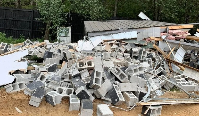 Storm damage cleanup and debris removal after property clearing project