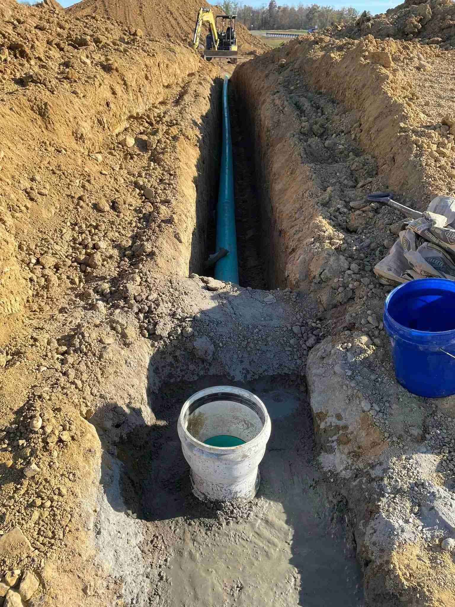 Sewer line excavation with SDR-35 pipe and concrete cleanout in deep trench W Services McMinnville TN