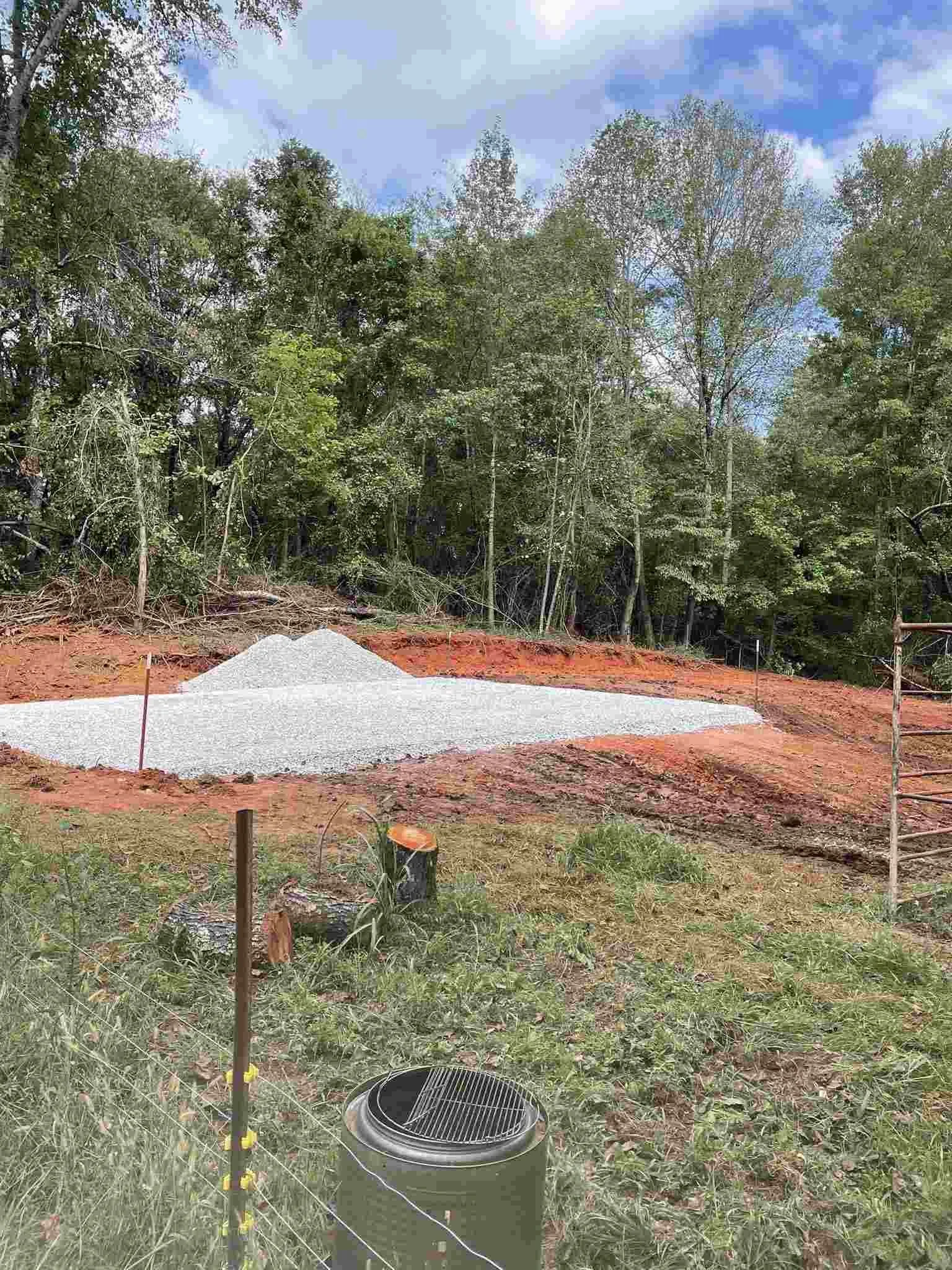 Completed excavation and site preparation with compacted gravel pad ready for concrete in McMinnville, TN