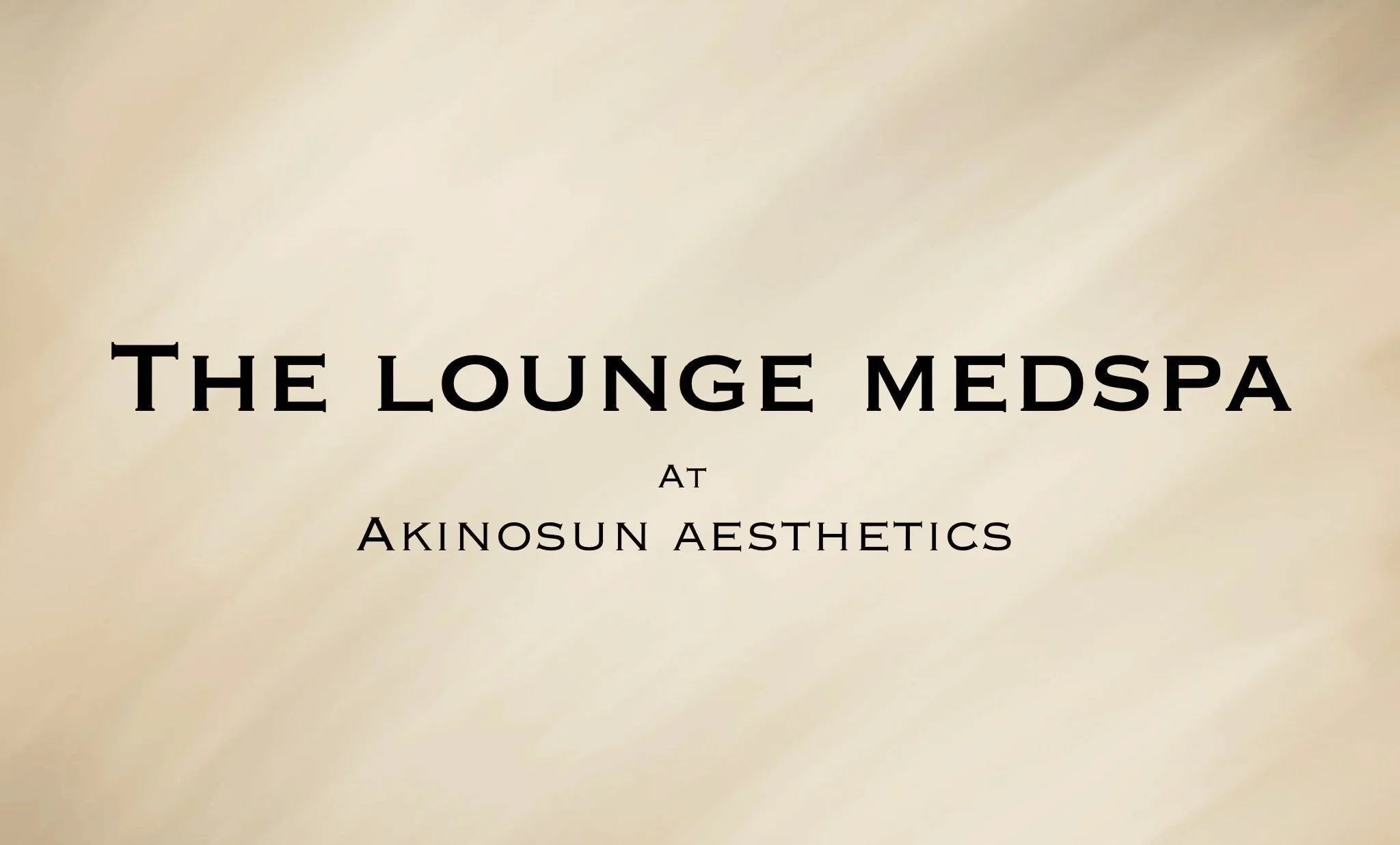 Text stating 'The lounge medspa at Akinosun Aesthetics' on a beige background.