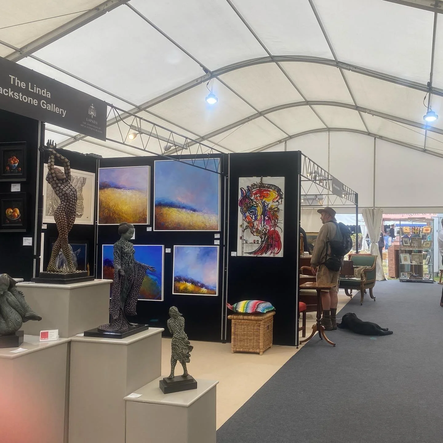 Art gallery exhibition stand, with sculptures and paintings, including Jonathan Hateley's sculptures, at The Linda Backstone Gallery