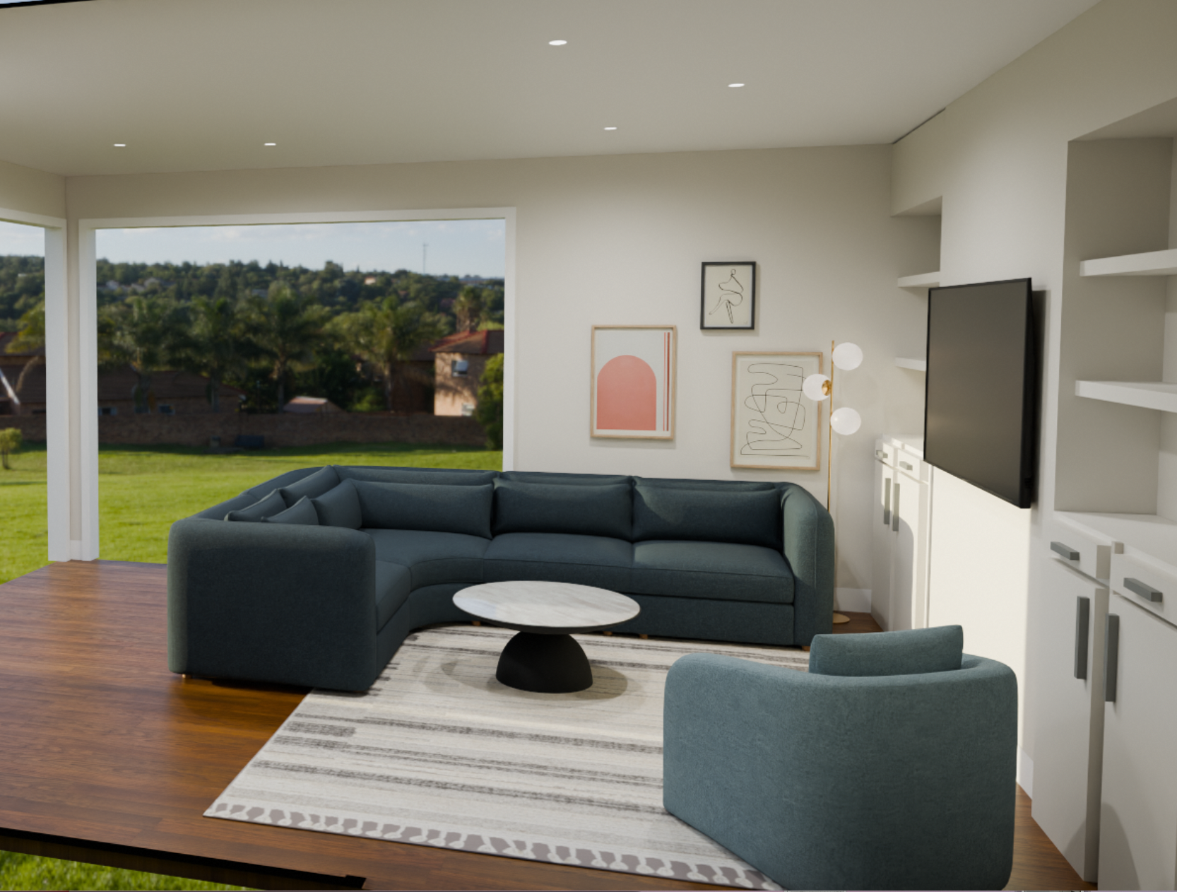 Living room with large window overlooking green yard, dark blue curved sofa, gray armchair, patterned rug, round marble coffee table, artwork on the wall, mounted TV, and white shelving.
