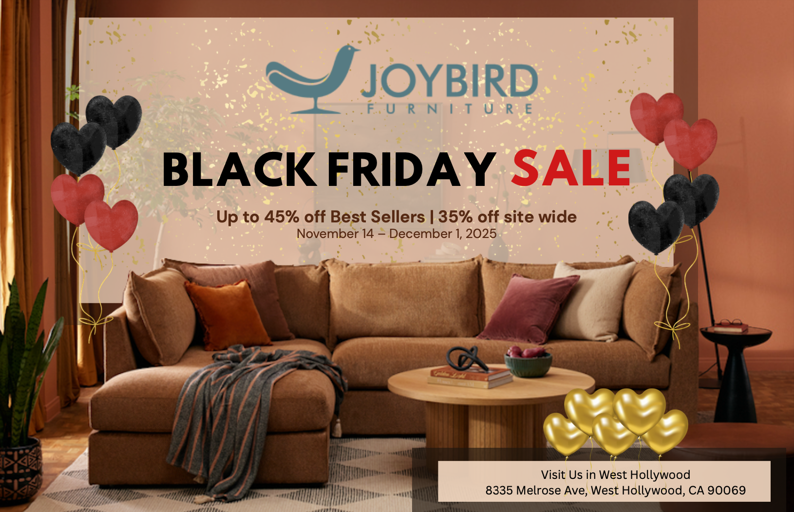 An advertisement for Joybird Furniture's Black Friday sale, featuring a cozy living room with a large brown sectional sofa, colorful pillows, and a round coffee table. The ad includes balloons, some black and red heart-shaped, and text announcing dis