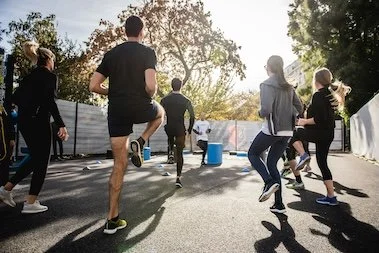 Group of people working out together outside