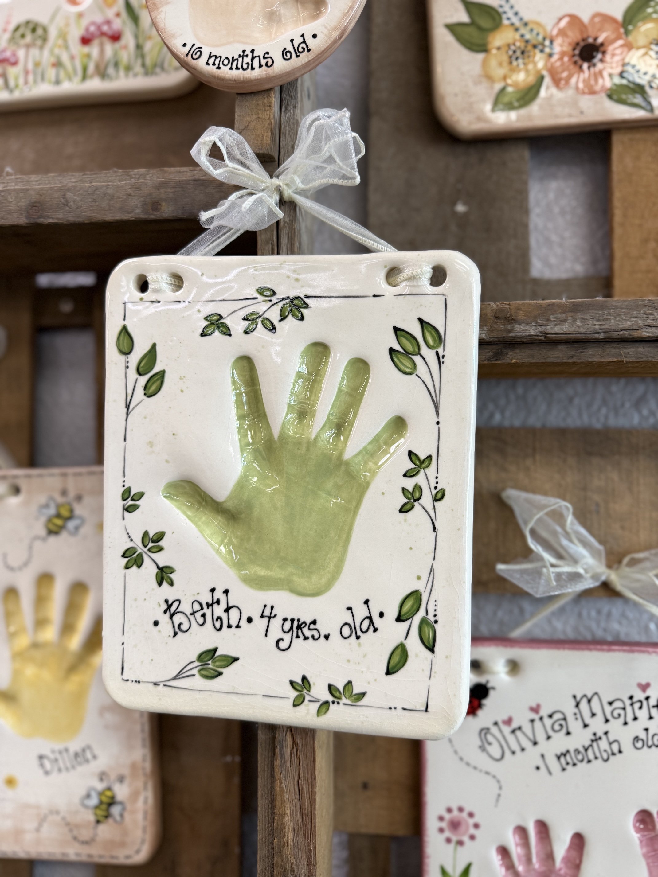 Green clay impression of a hand