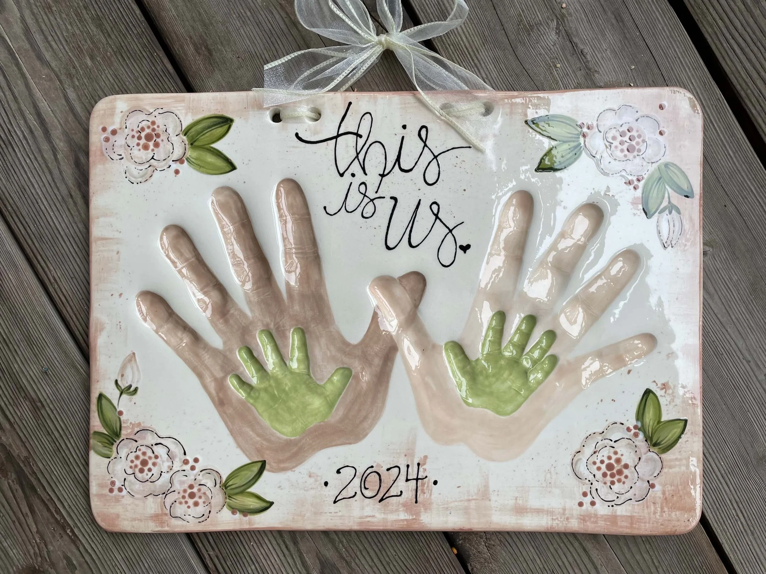 Two parent and two child handprint impressions