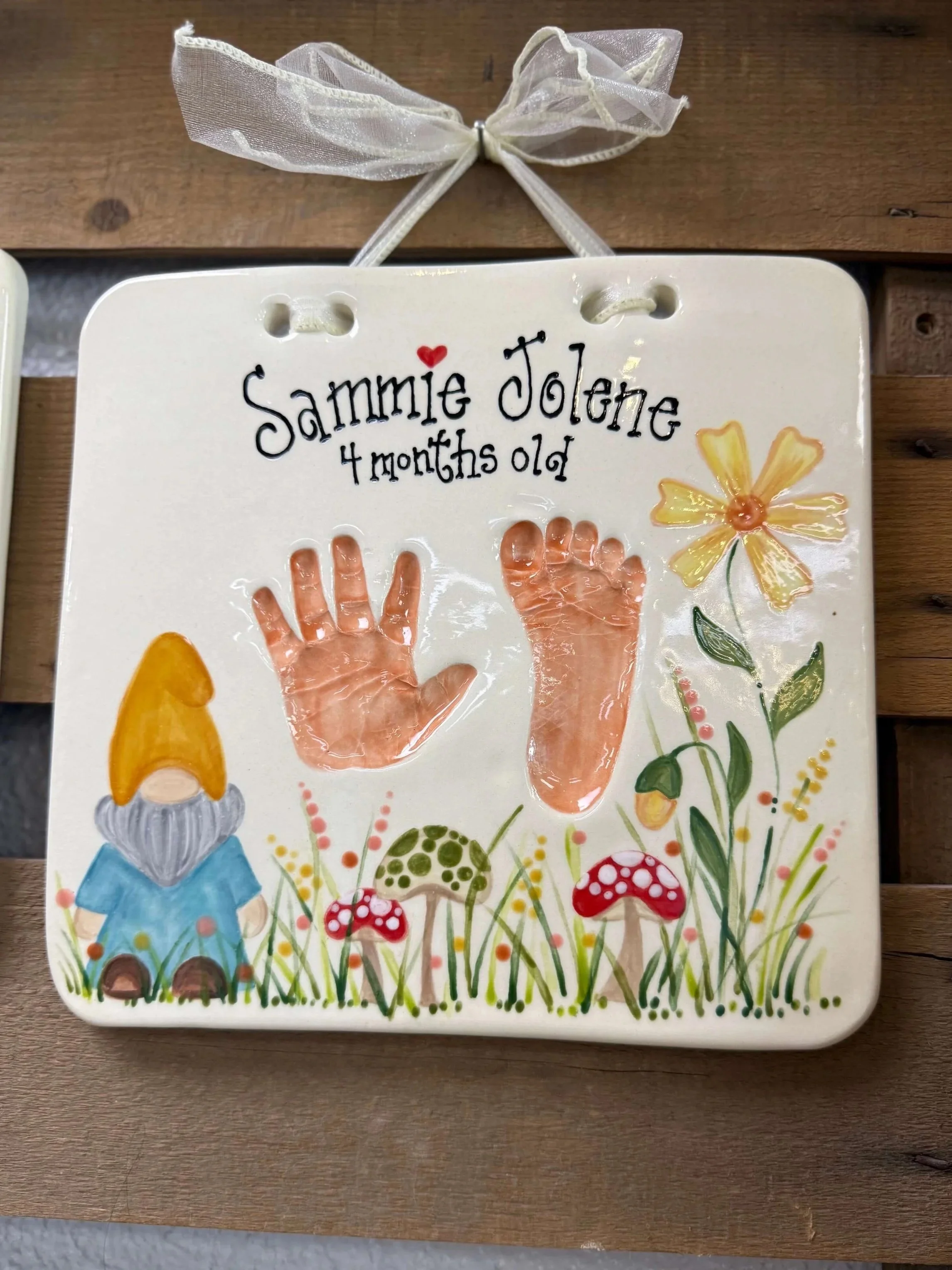 A hand and foot impression among a nature landscape