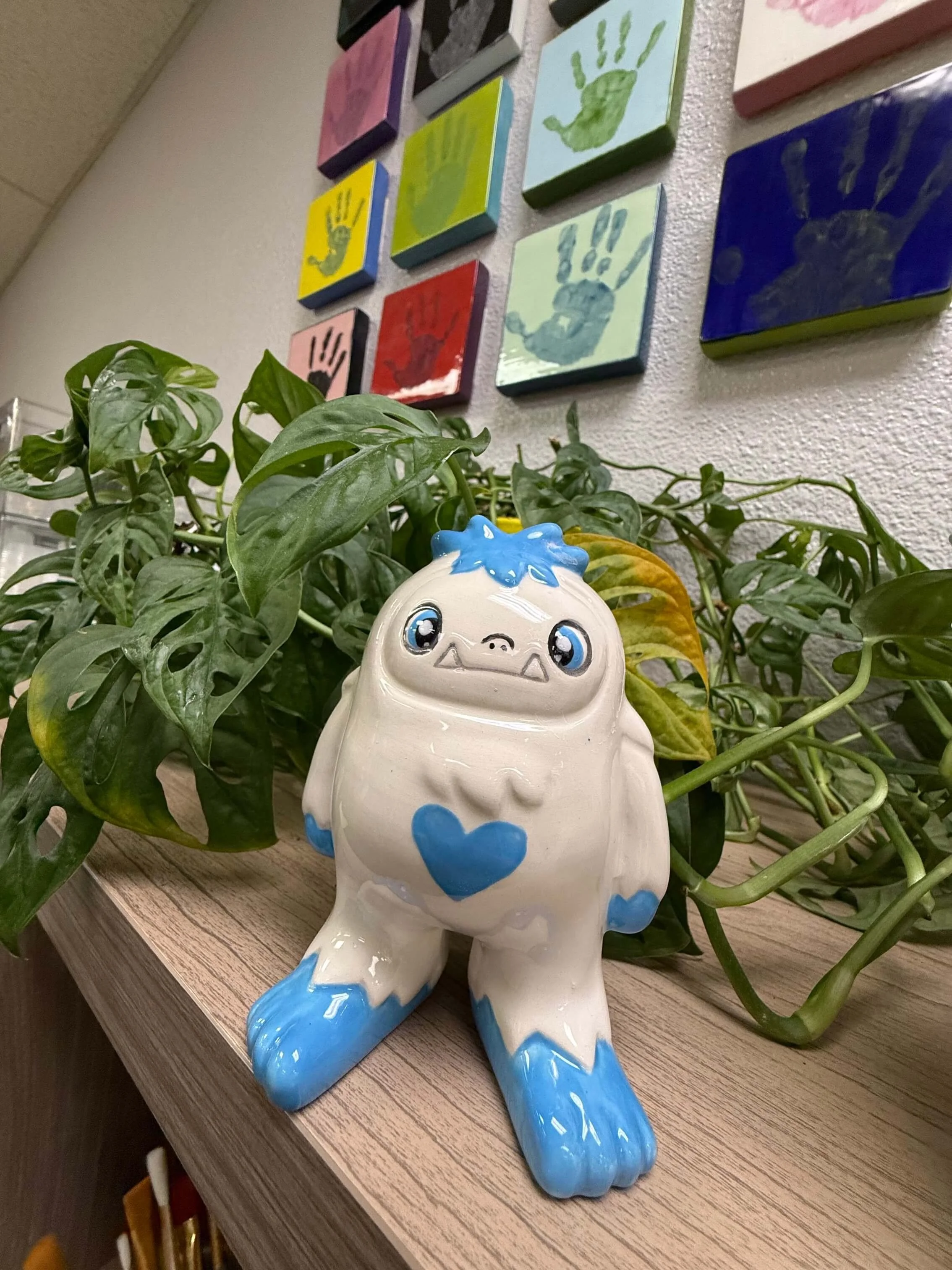A yeti statue sits on a shelf