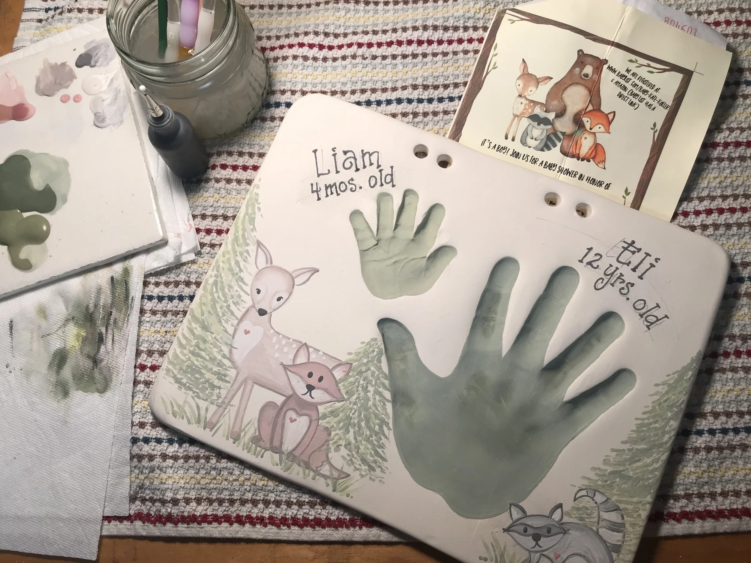 Green clay impressions of hands