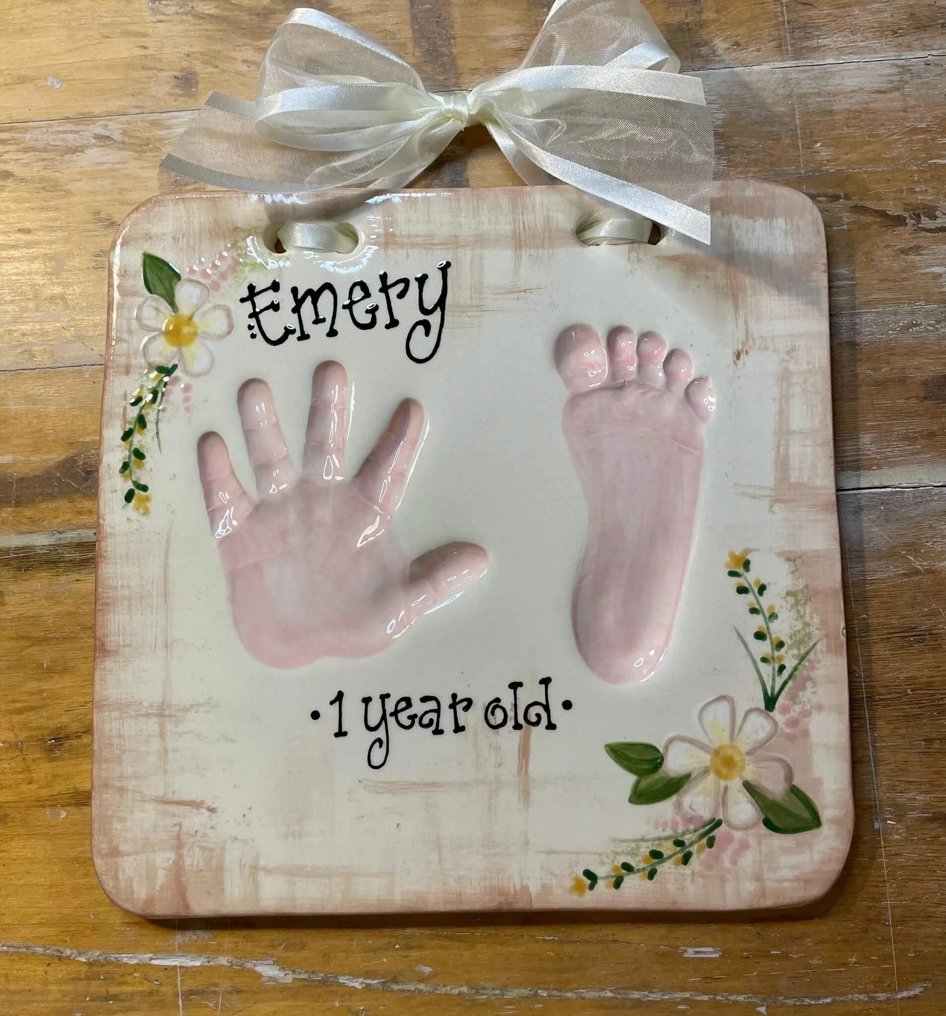 Clay impression of a 1 year old's hand and foot