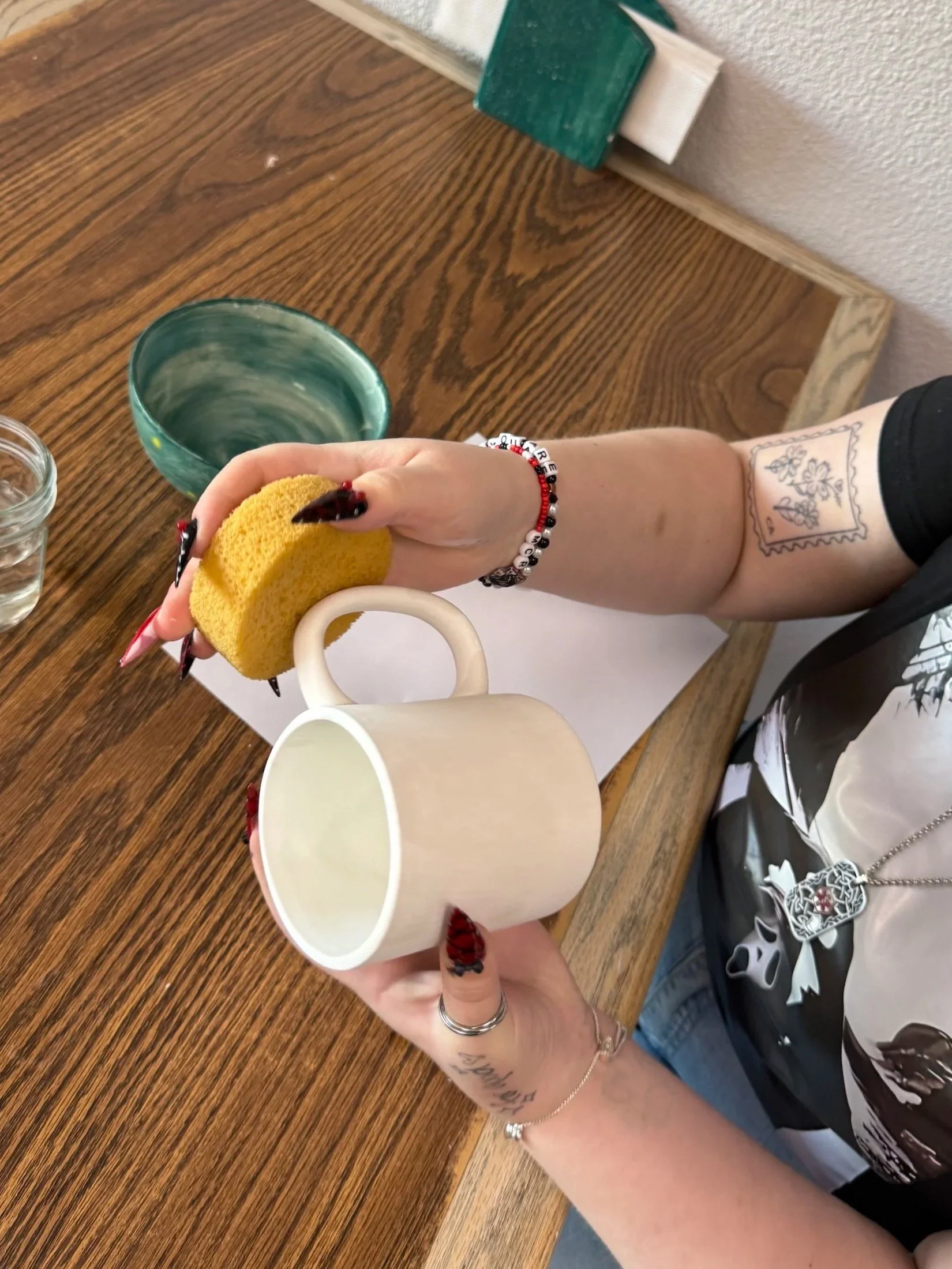 Unpainted pottery rainbows and piggy banks