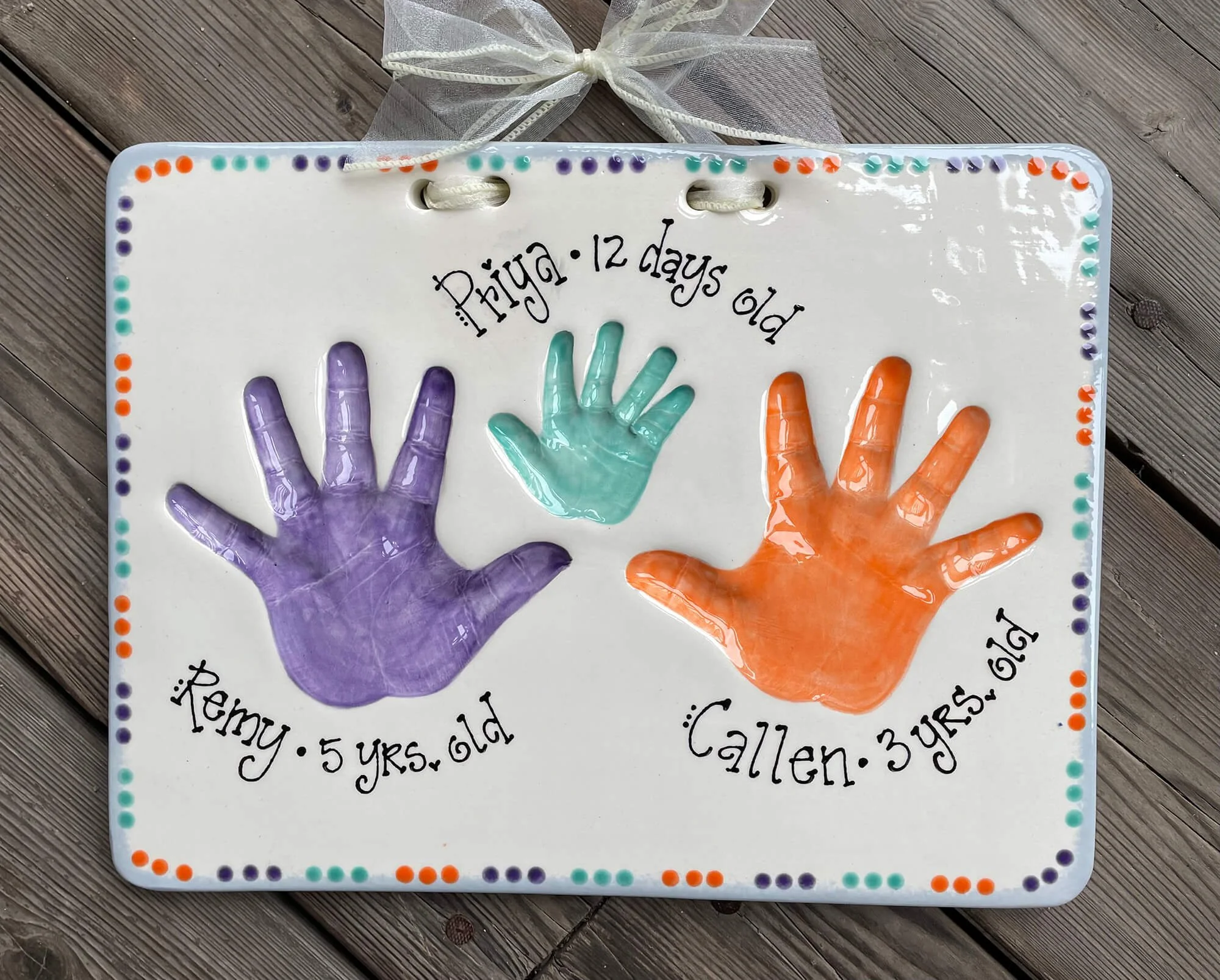 Clay impressions of three hands