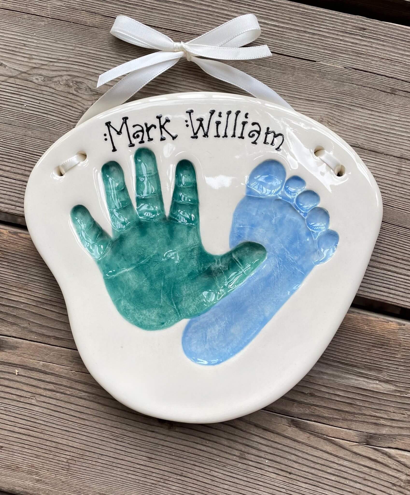 An overlapping hand and foot impression