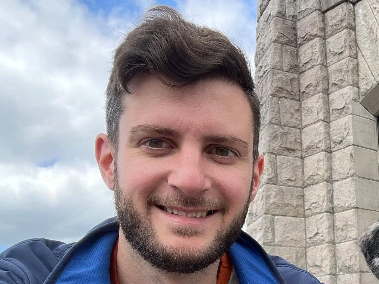 Ben Green sitting in front of Vista House.