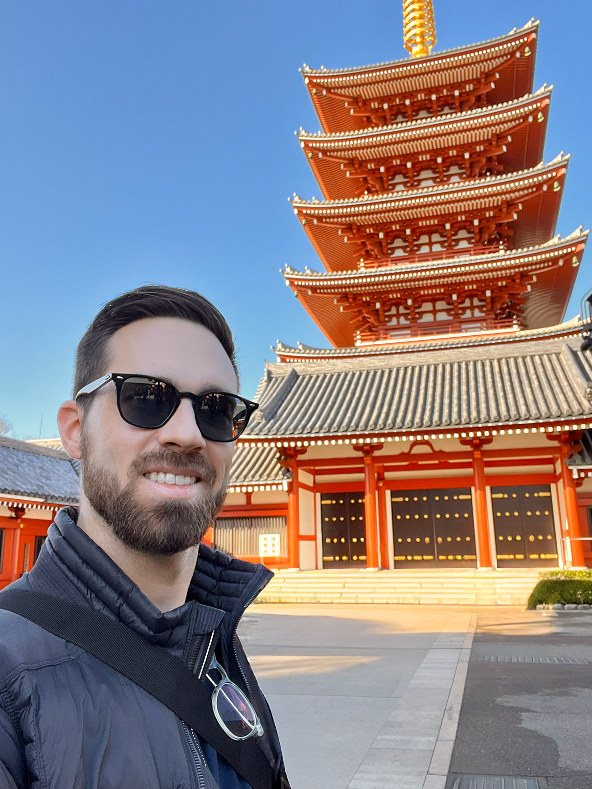 Will Gossett standing in front of a Pagoda.