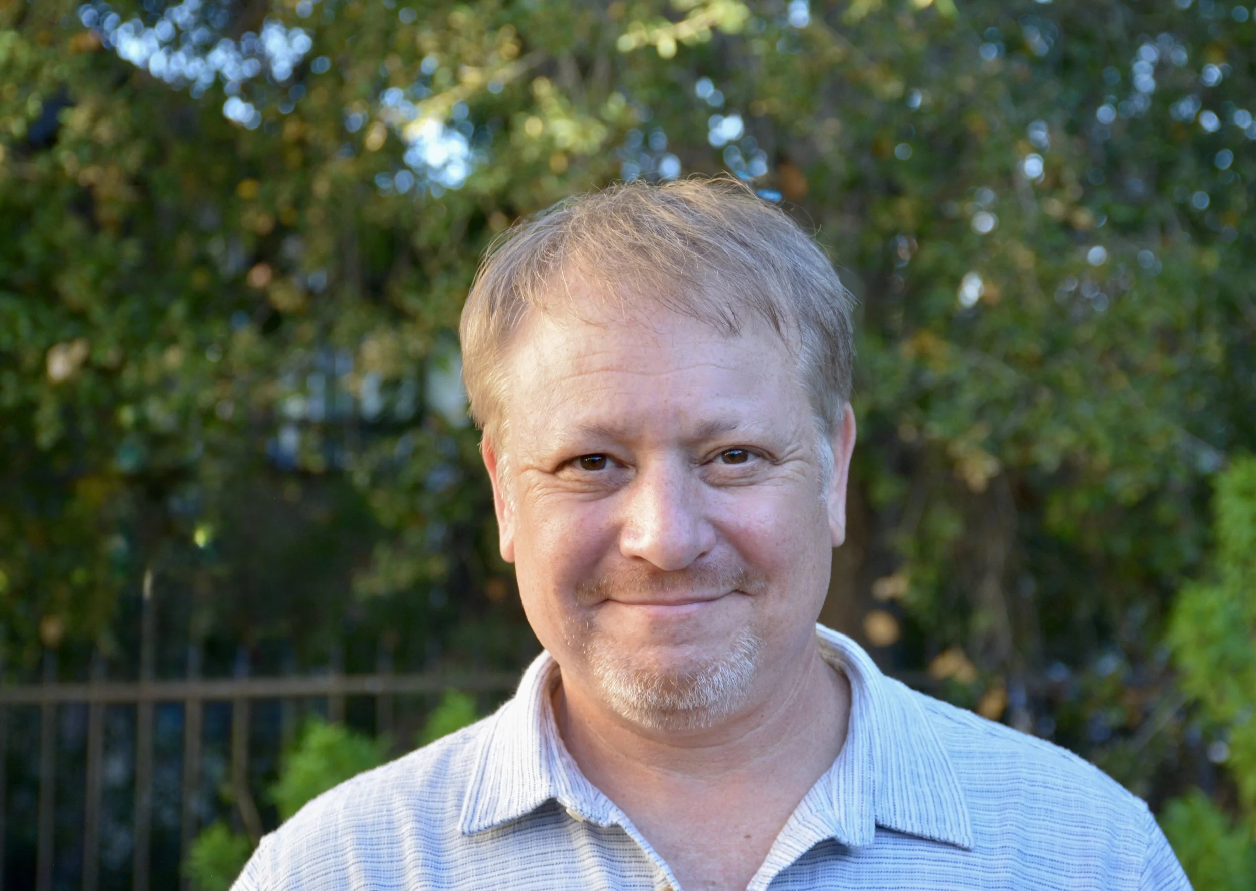 Matt Firestone standing in his back yard.