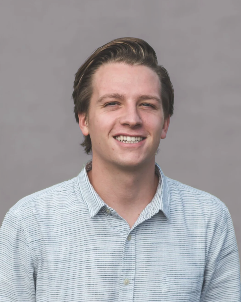 Tyler Ericson standing in front of a gray backdrop.