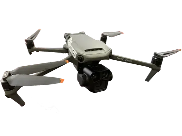 A gray DJI Mavic drone with four propellers and a camera mounted underneath.