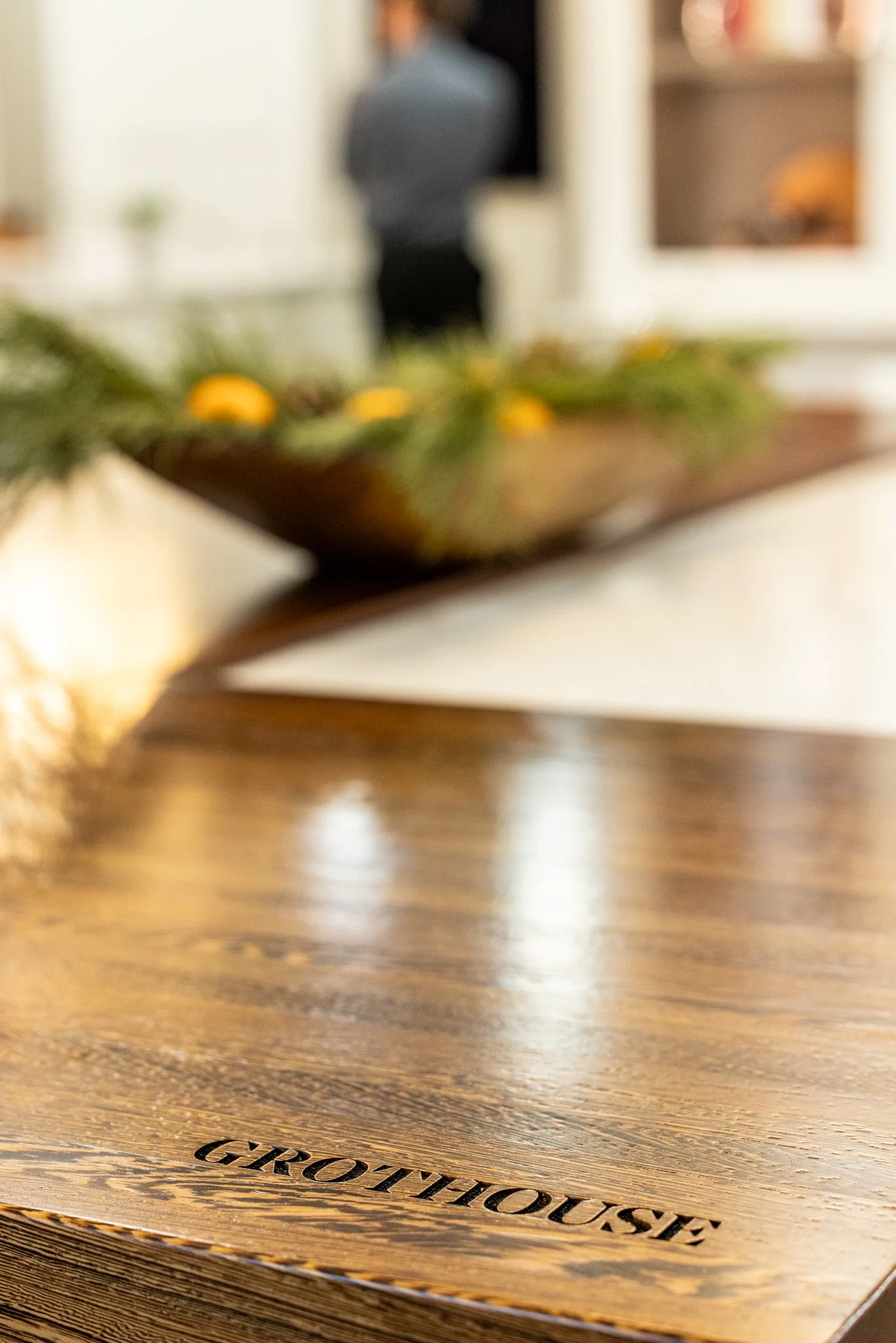 A luxury Grothouse wood countertop display featuring a custom branded engraving at the Crown Cabinetry showroom in Chetek, Wisconsin.