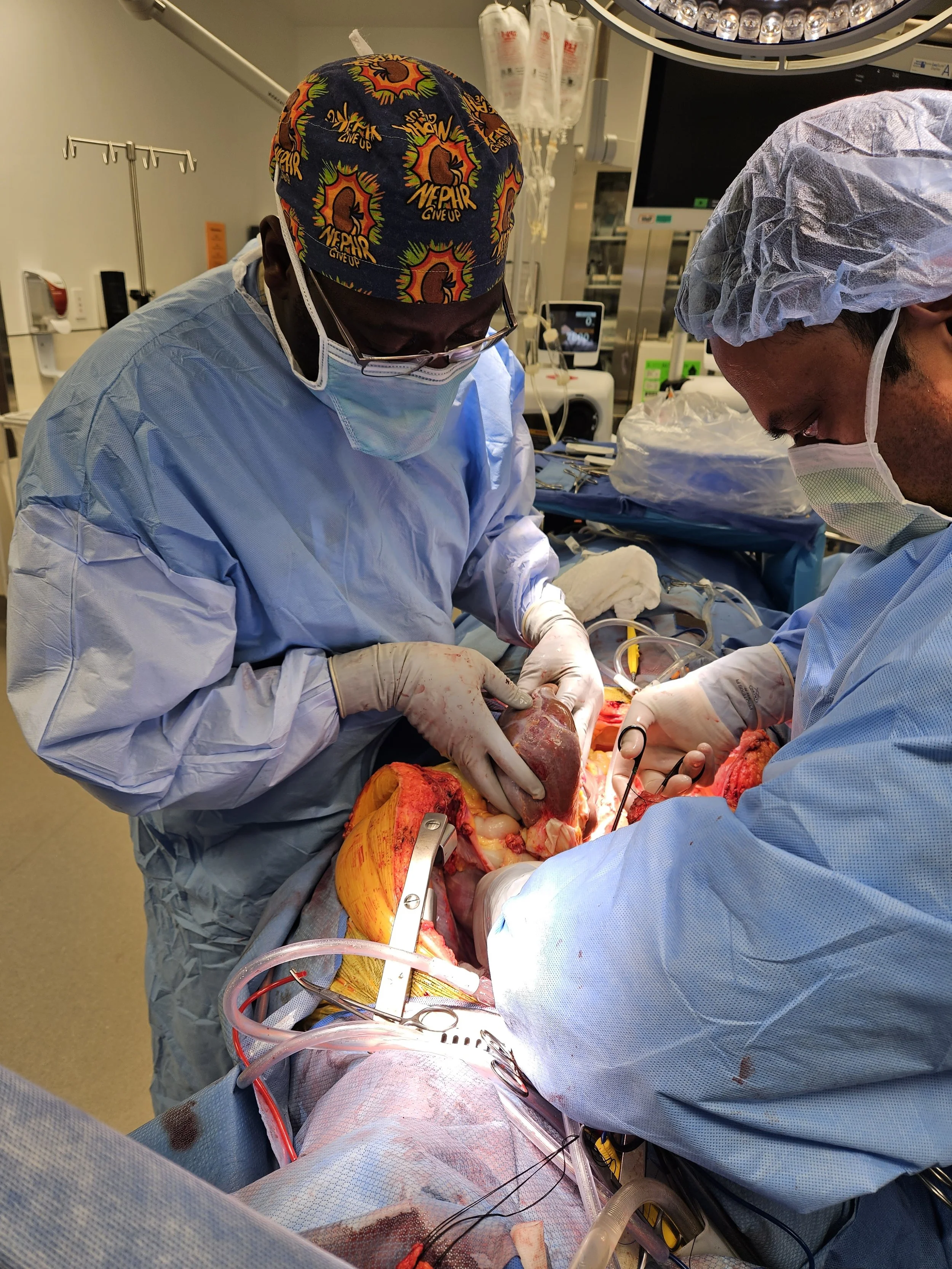 Surgeons performing an open-heart surgery in an operating room.
