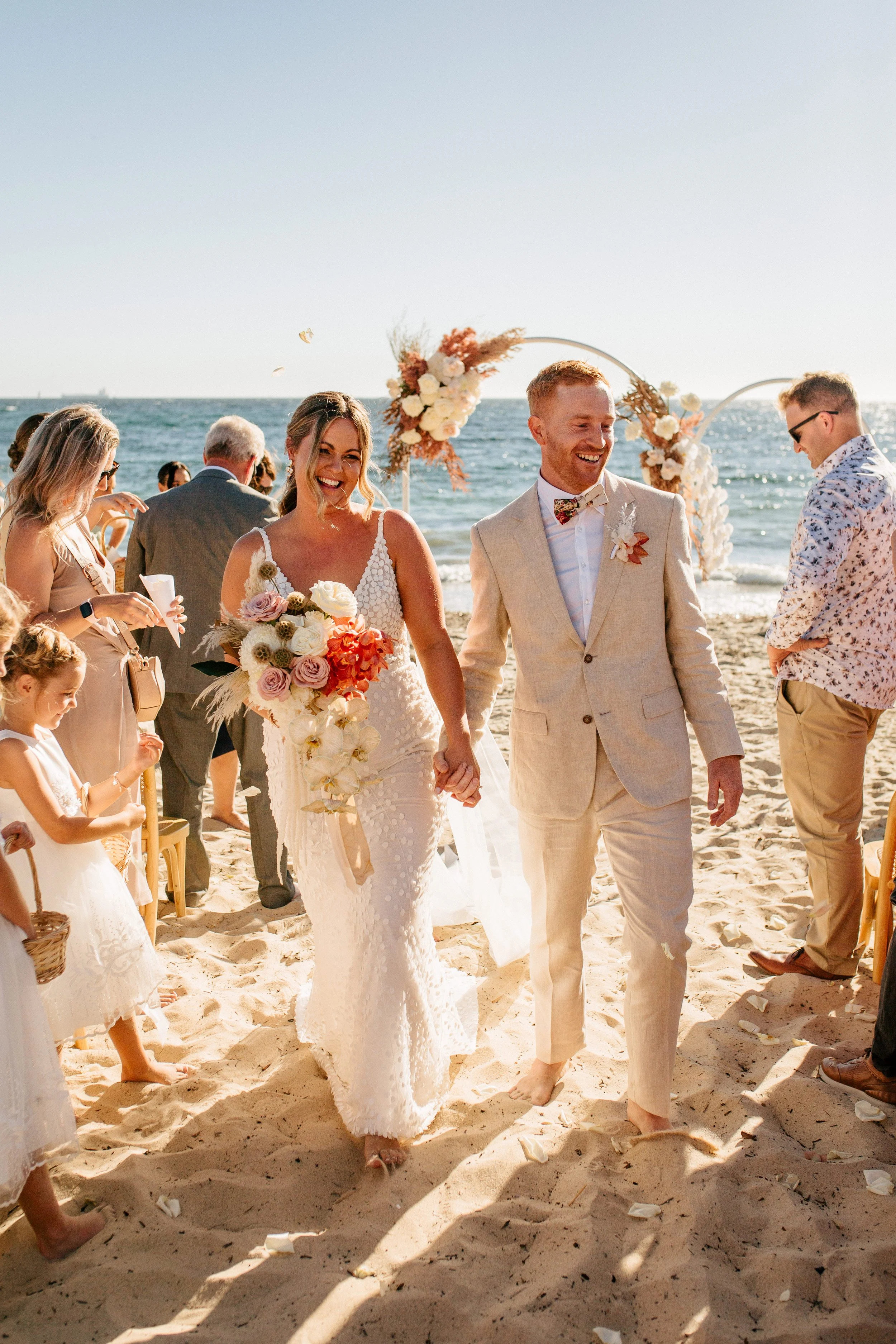 Couple celebrating their wedding on the sand at Bathers Beach, Fremantle