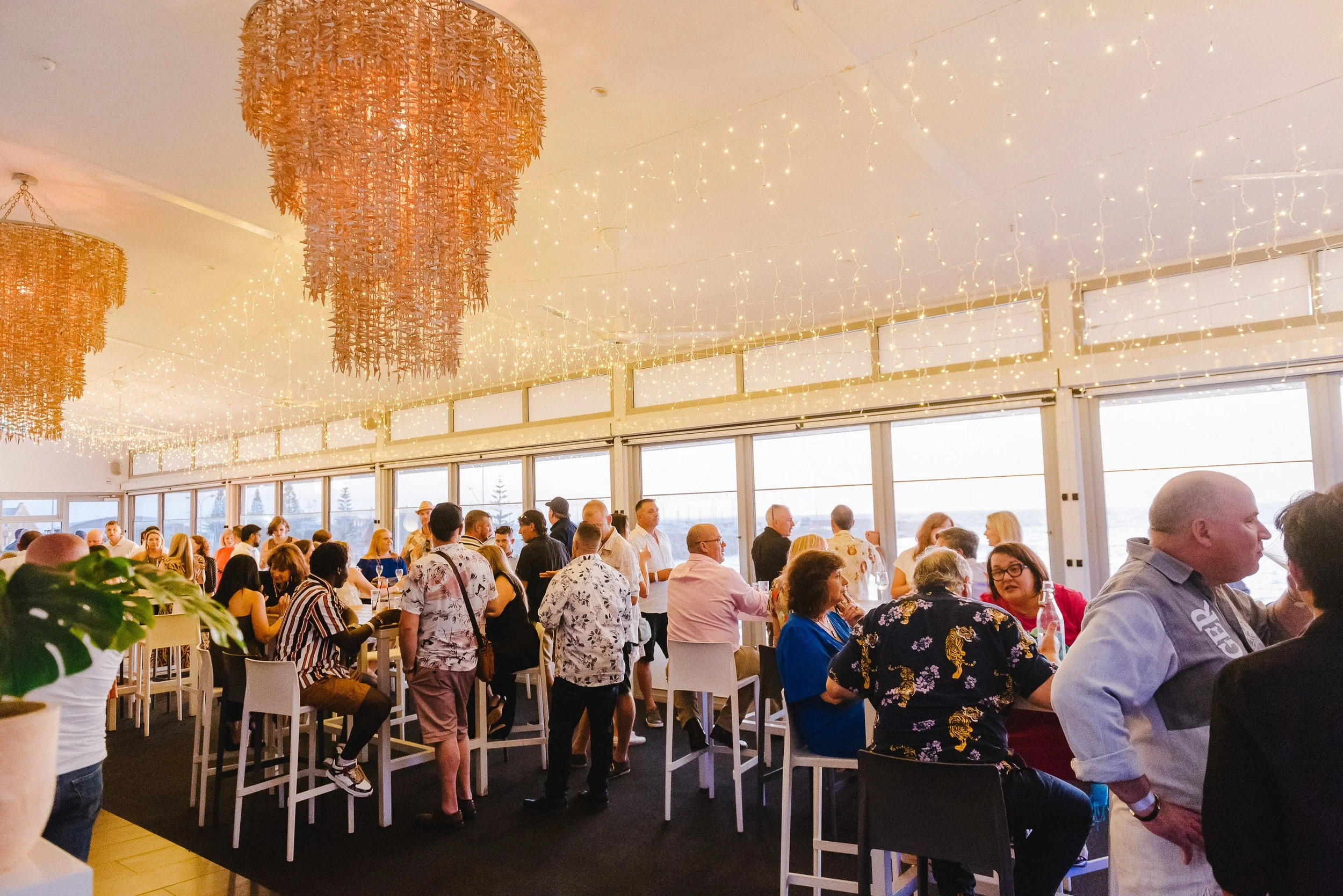 Guests networking upstairs at Bathers Beach House function room, Fremantle
