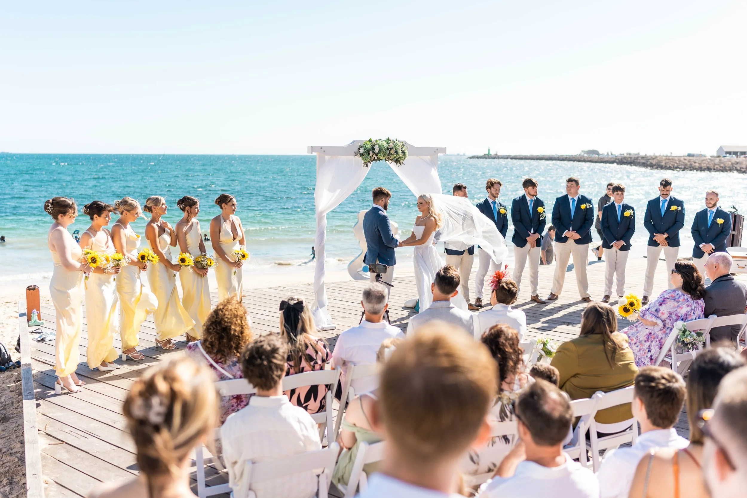 Beach ceremony on the boardwalk in front of Bathers Beach House