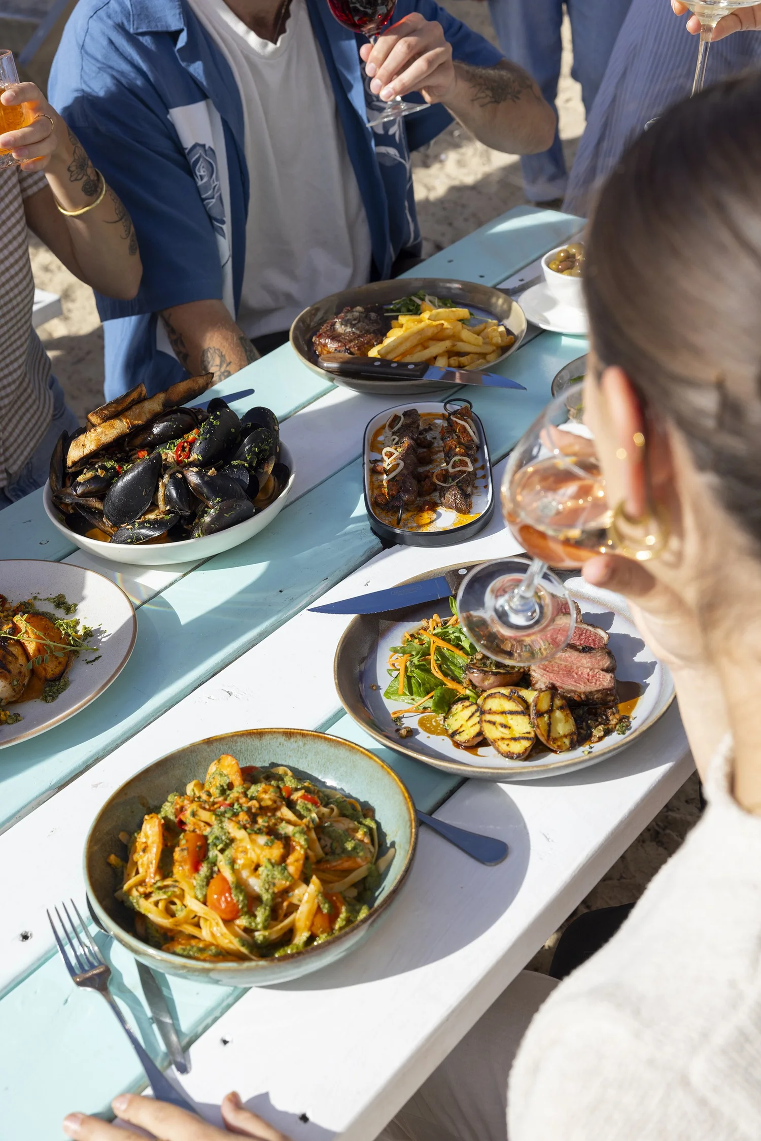 Shared beachside dining at Bathers Beach House, Fremantle