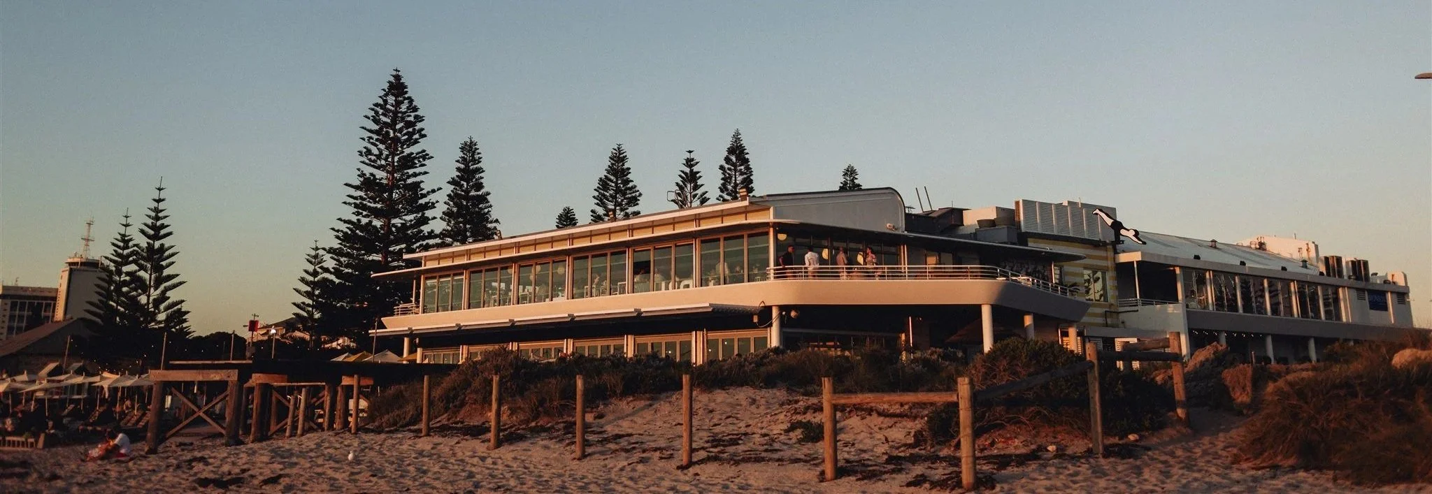 Bathers Beach House seen from the dunes of Bathers Beach, Fremantle, at dusk