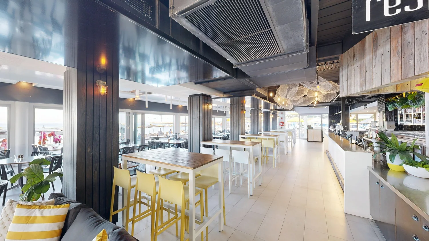 Restaurant high bar tables at Bathers Beach House