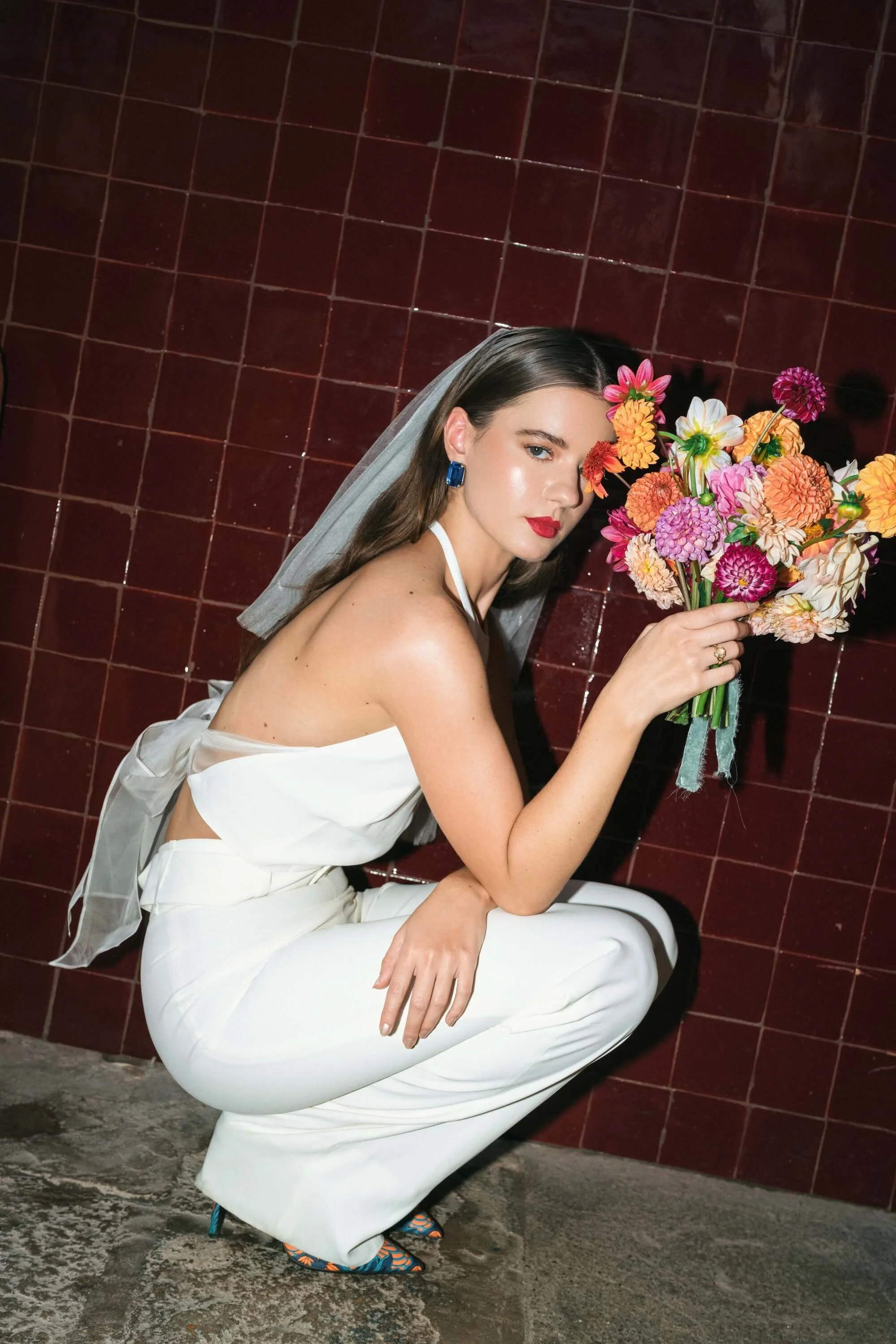 editorial wedding couple portrait with modern styling and yellow floral installation