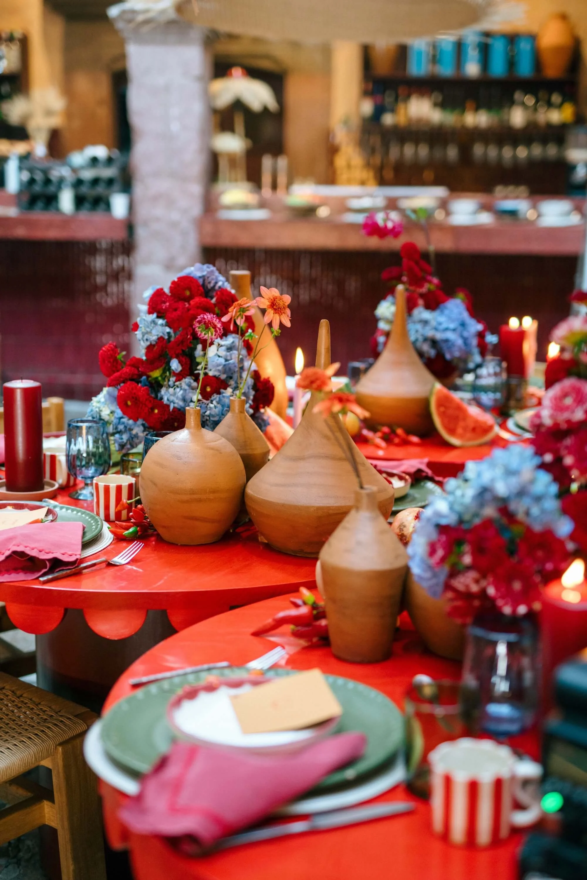 modern Mexican tablescape with bright colors, fruit accents and candles