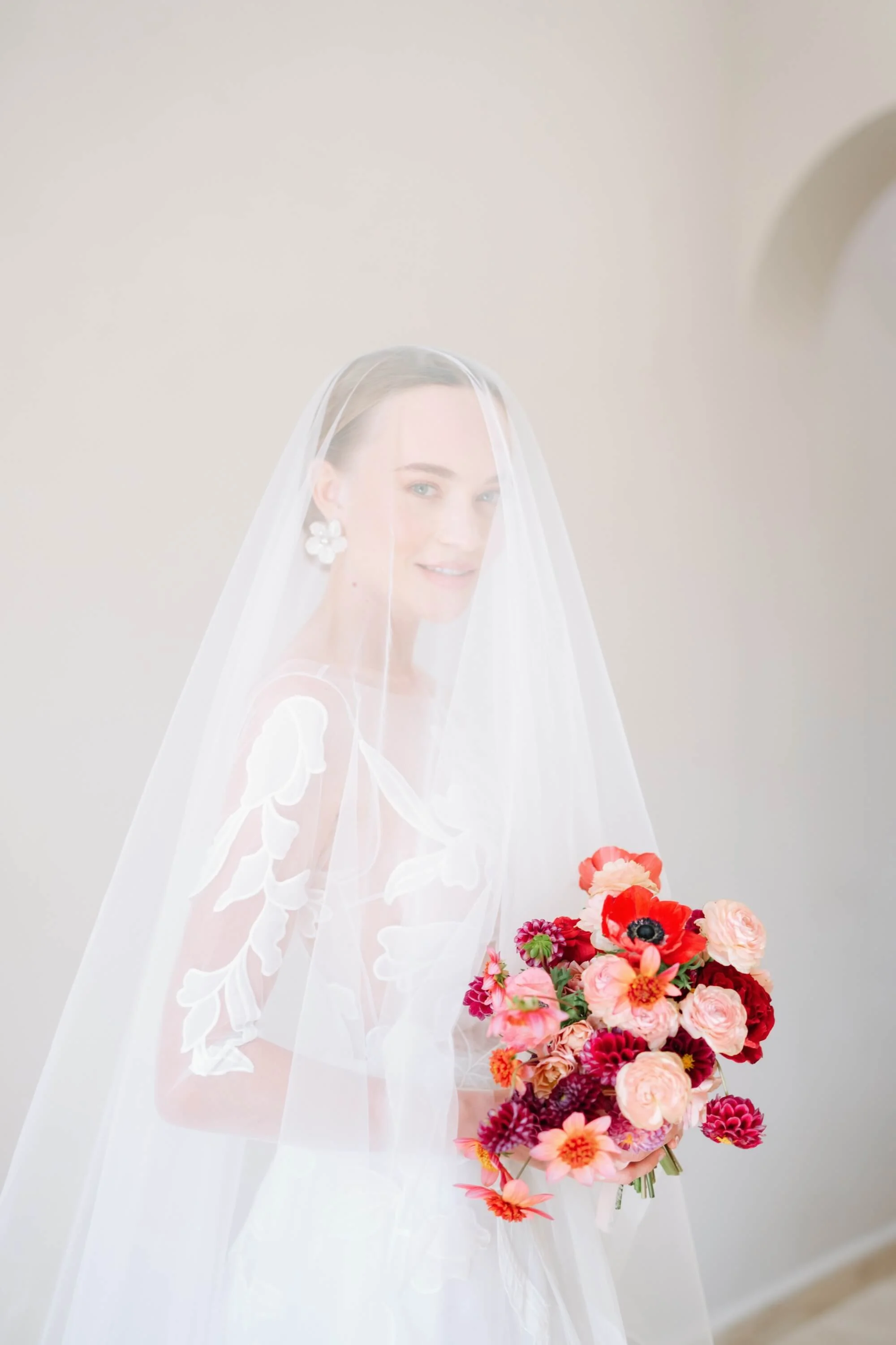 Luxury bridal bouquet with red, blush and peach flowers designed by Florklor Studio