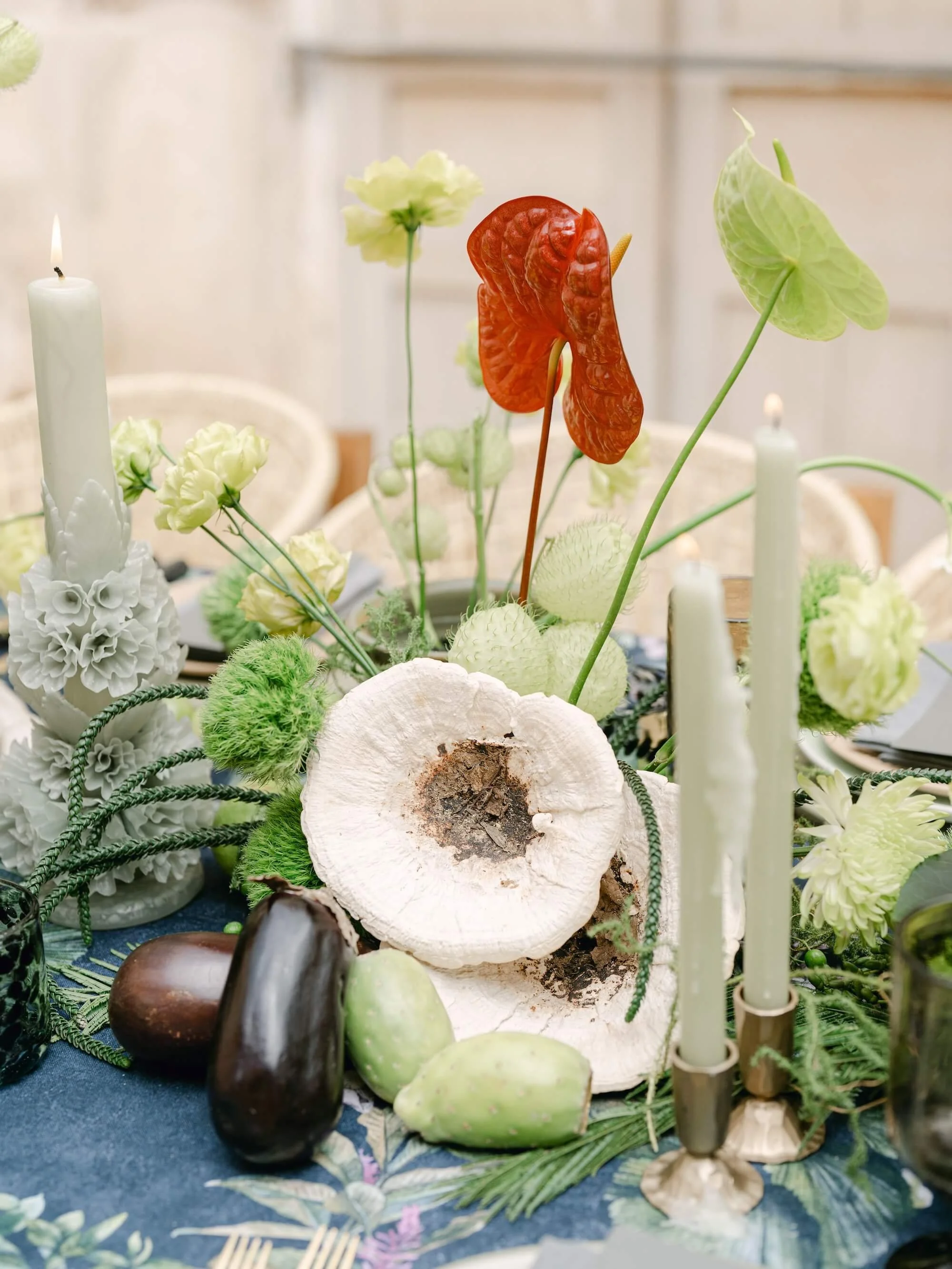 bride and groom celebrating outdoor wedding with floral details and greenery installation Mexico