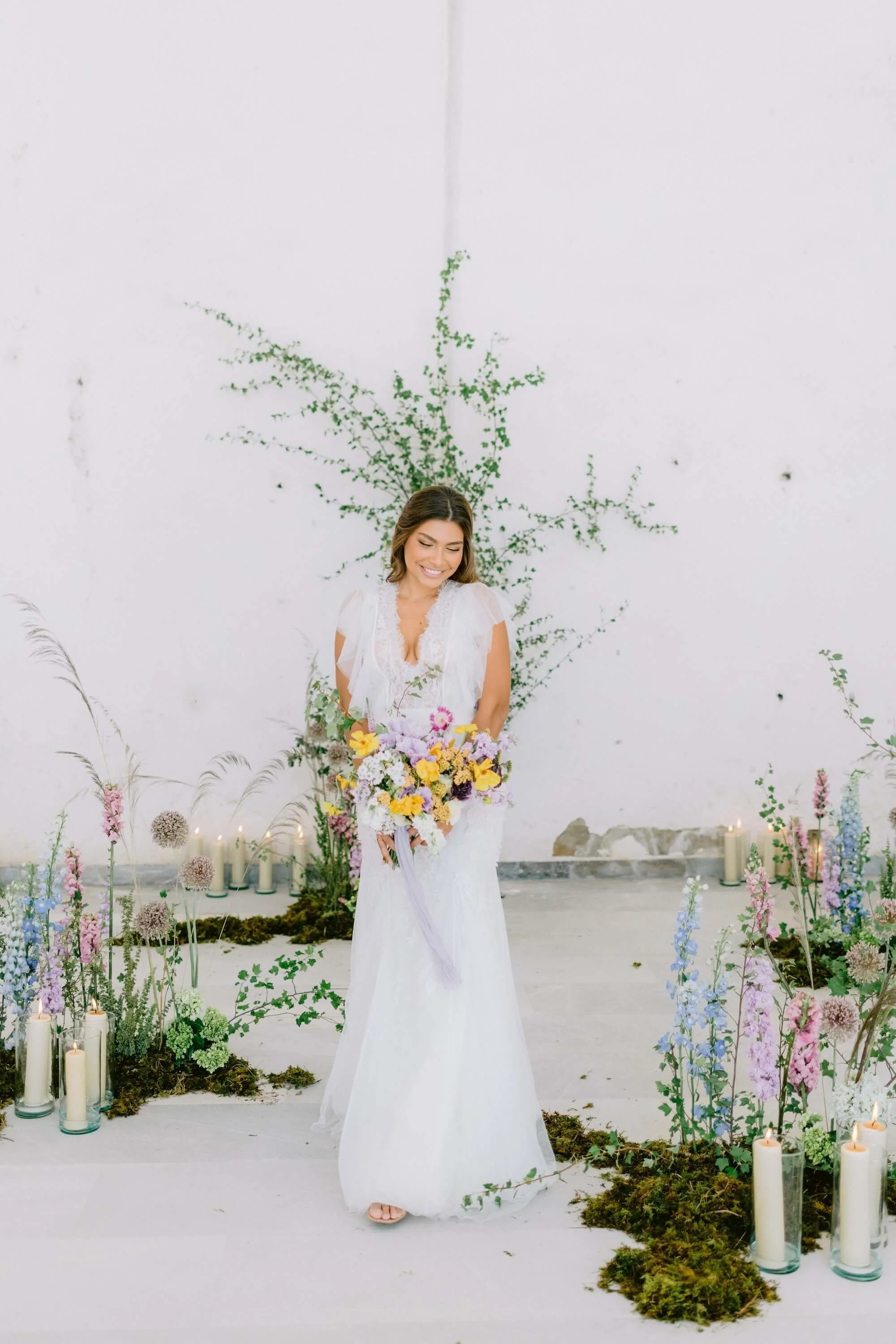 joyful bride and groom walking with colorful bouquet in destination wedding Mexico