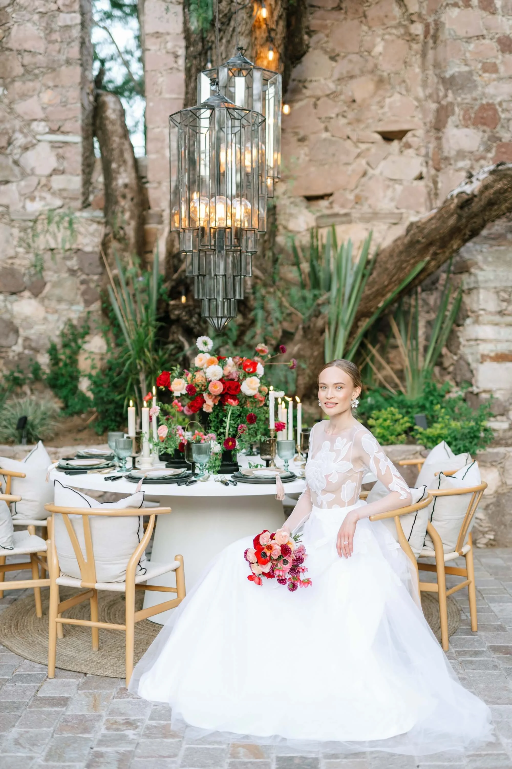 Bespoke wedding flowers combining soft neutrals and bold red tones