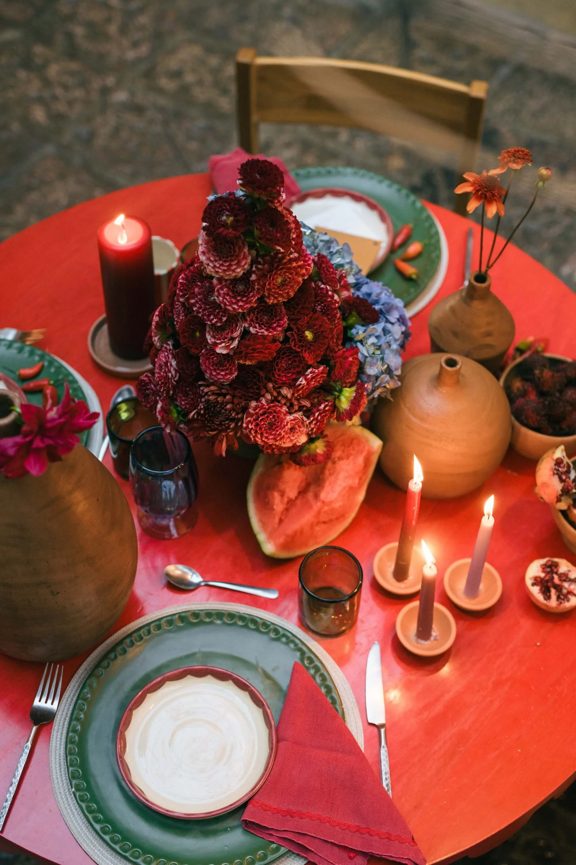 artistic tablescape with layered textures and colorful floral design