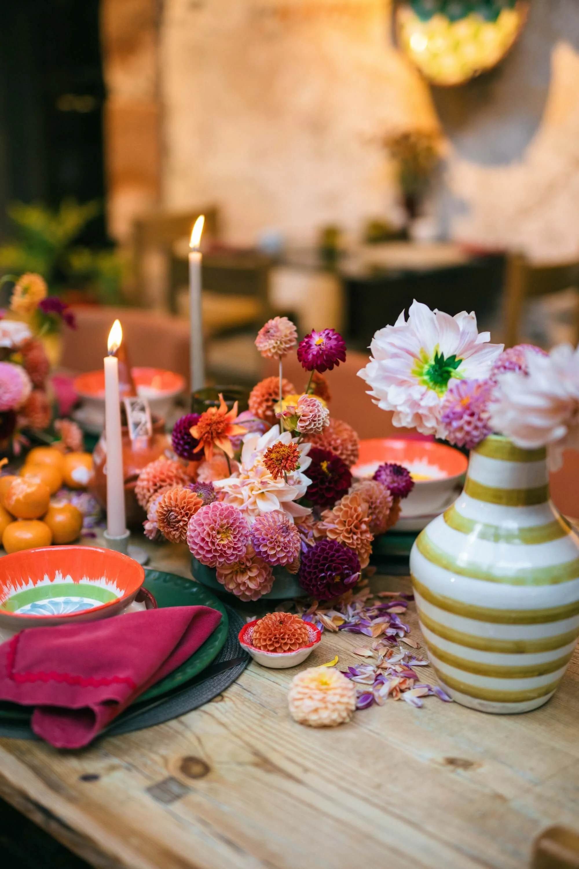 vibrant floral centerpiece with dahlias and mixed blooms on rustic table