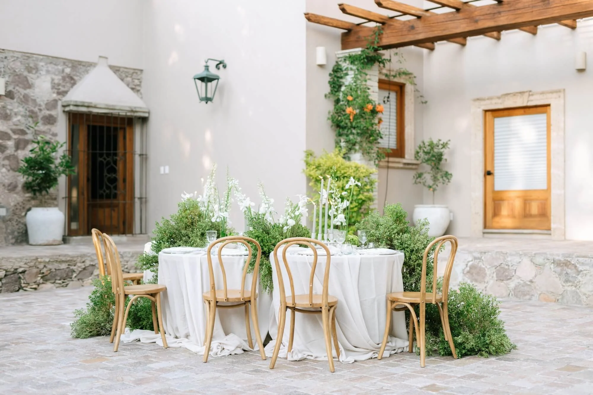 High-end floral design with red and blush flowers for destination wedding in Mexico