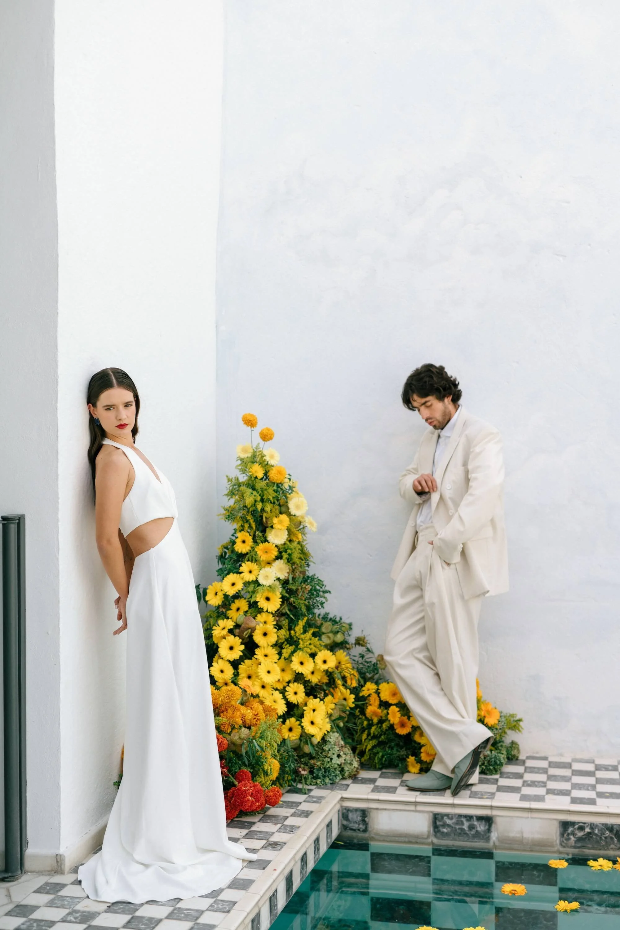 modern bridal editorial with sculptural composition and vibrant flowers