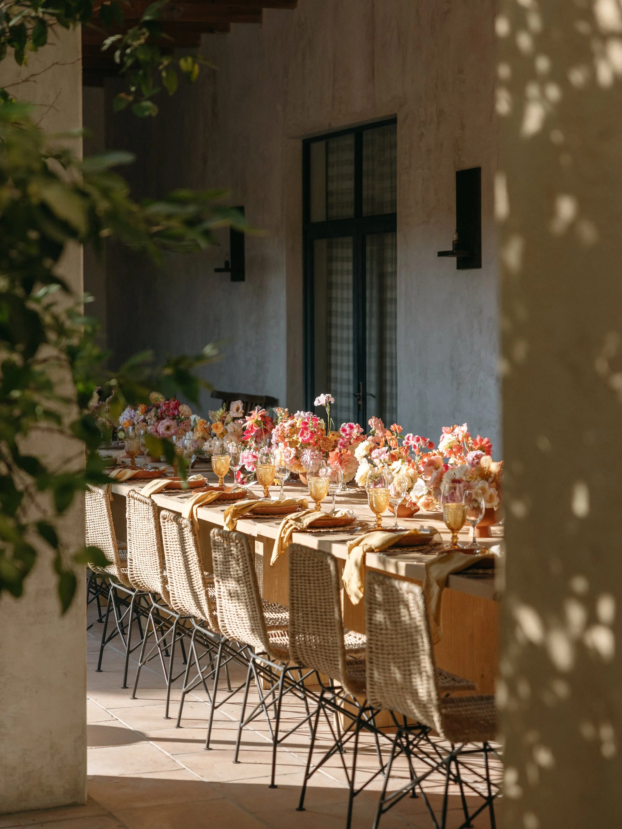 destination wedding ceremony with soft neutral flowers and landscape