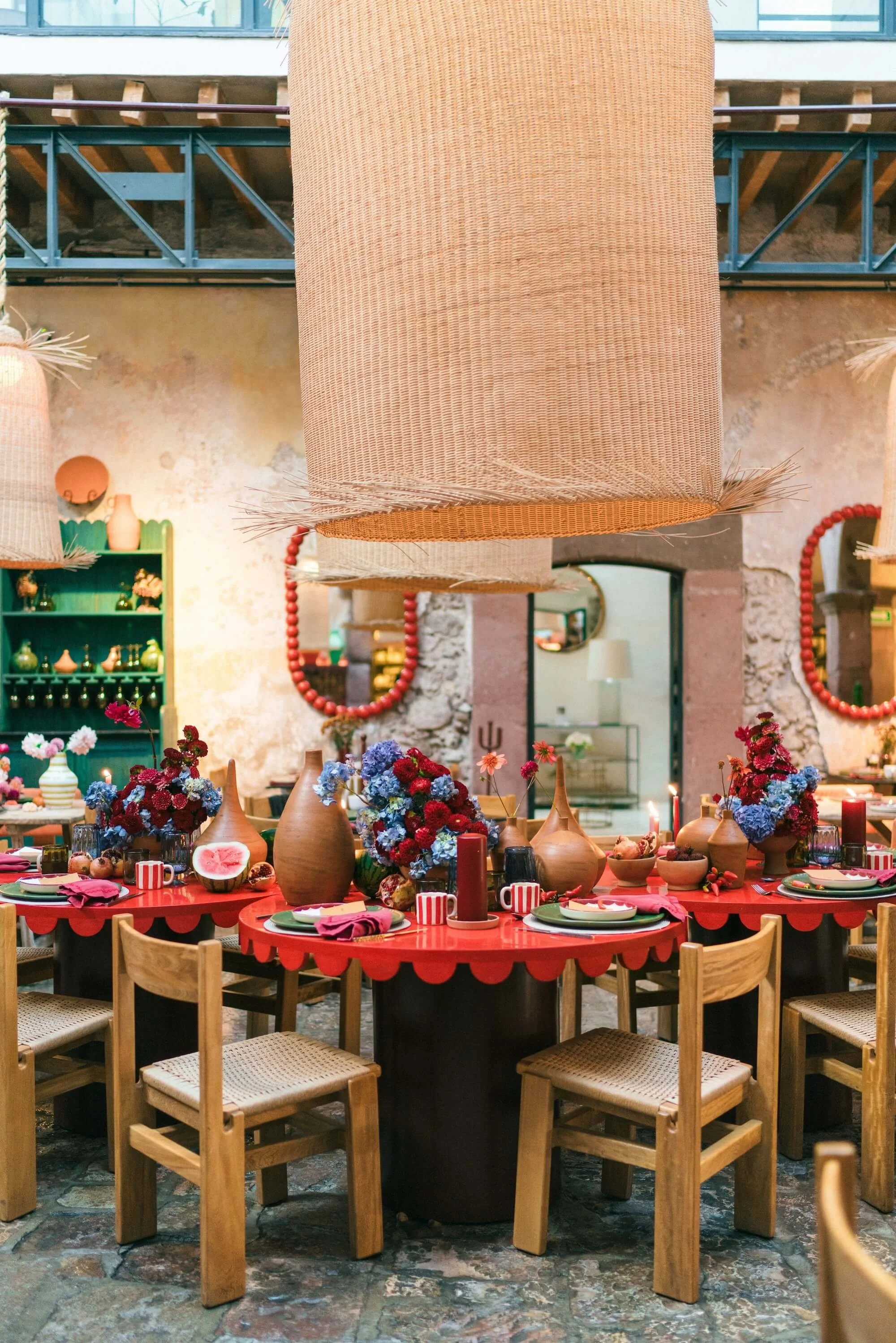 creative wedding decor with bright flowers, candles and handcrafted ceramics