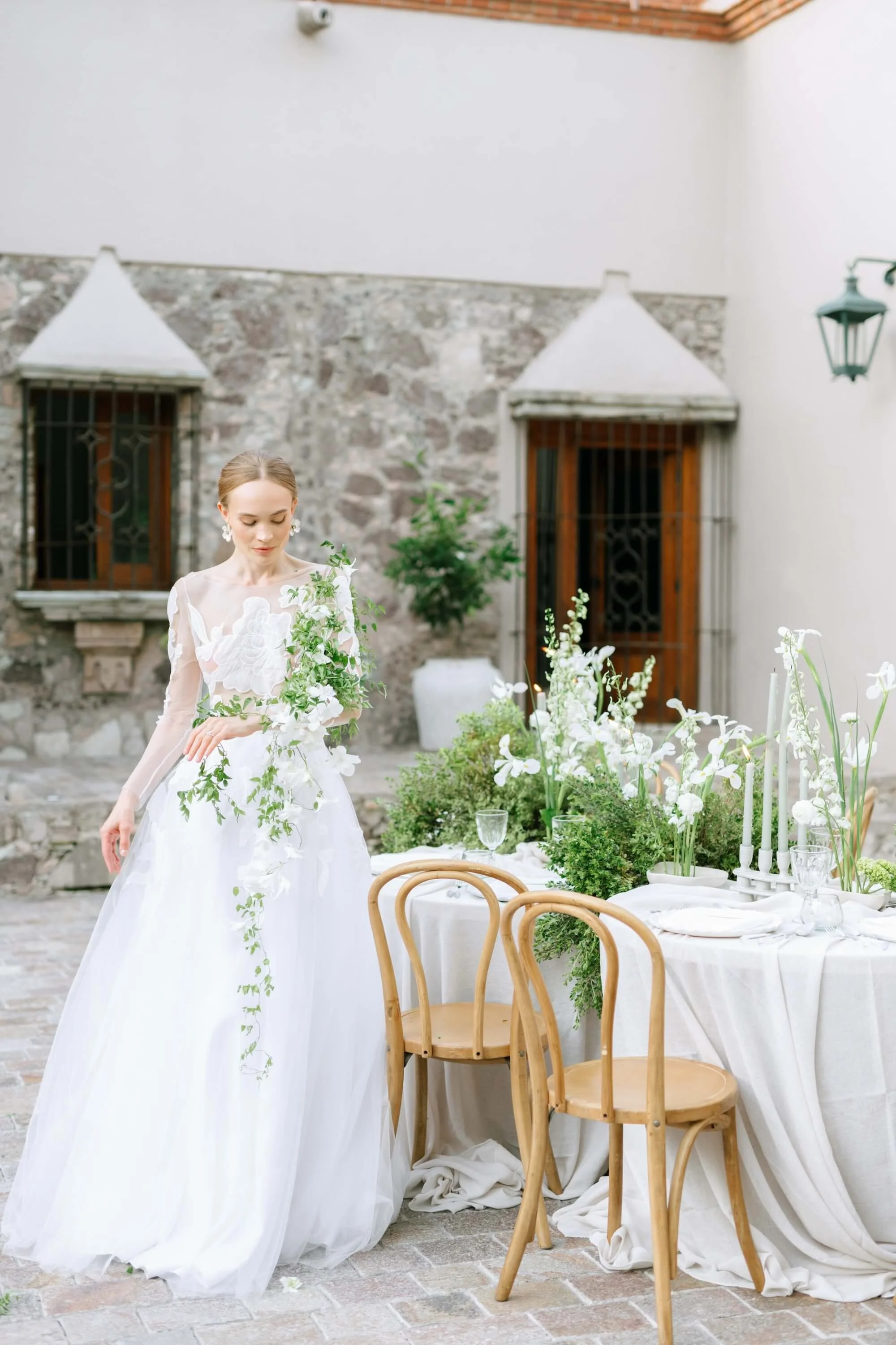Artistic wedding floral centerpiece with layered textures and seasonal blooms