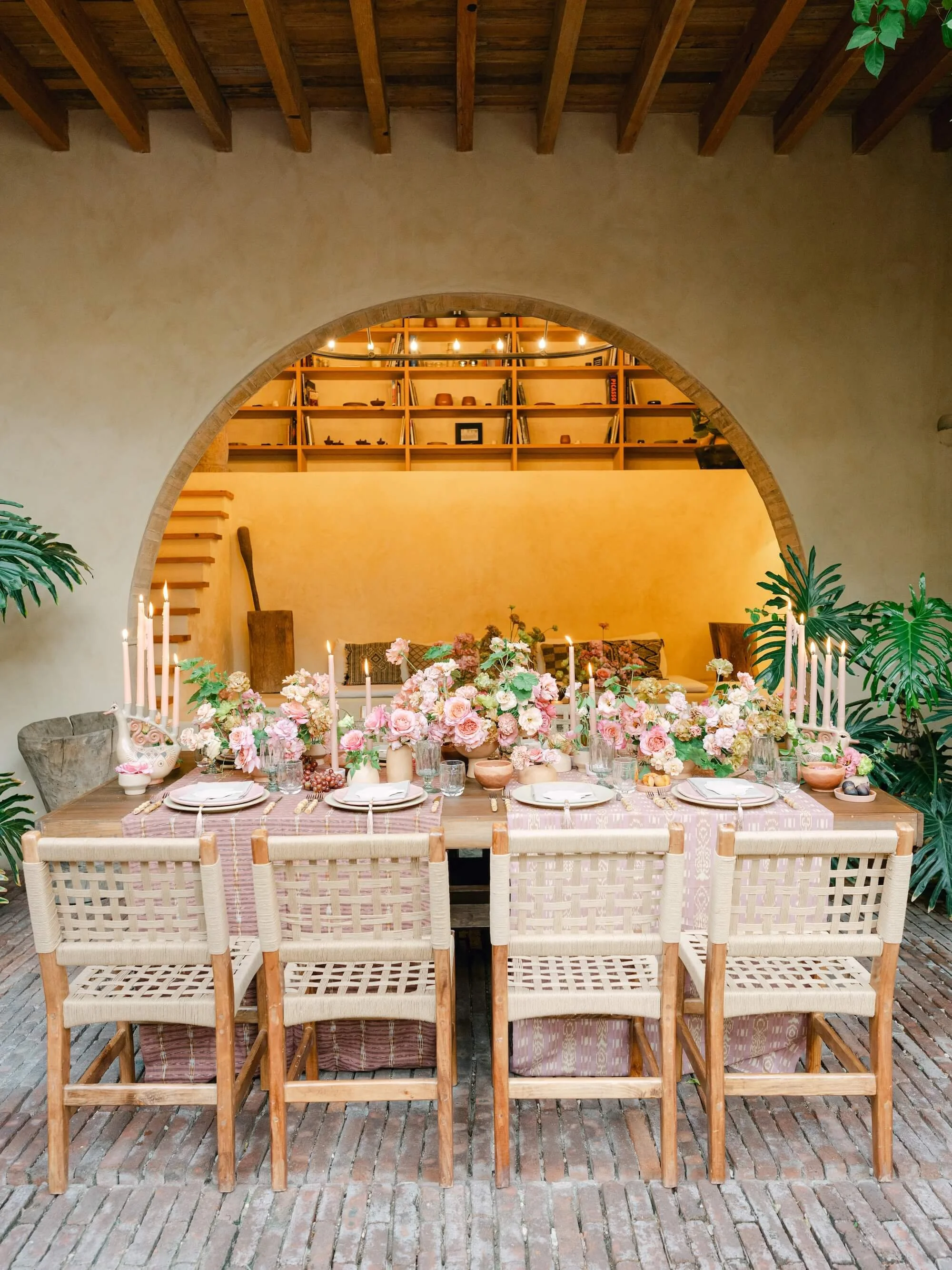 destination wedding floral design with abundant foliage and organic styling