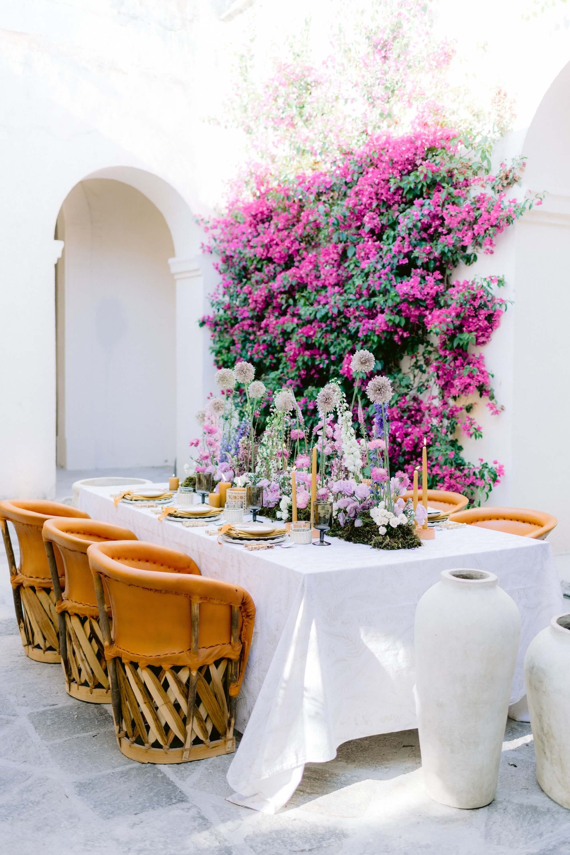 romantic wedding celebration with colorful florals and natural ceremony styling