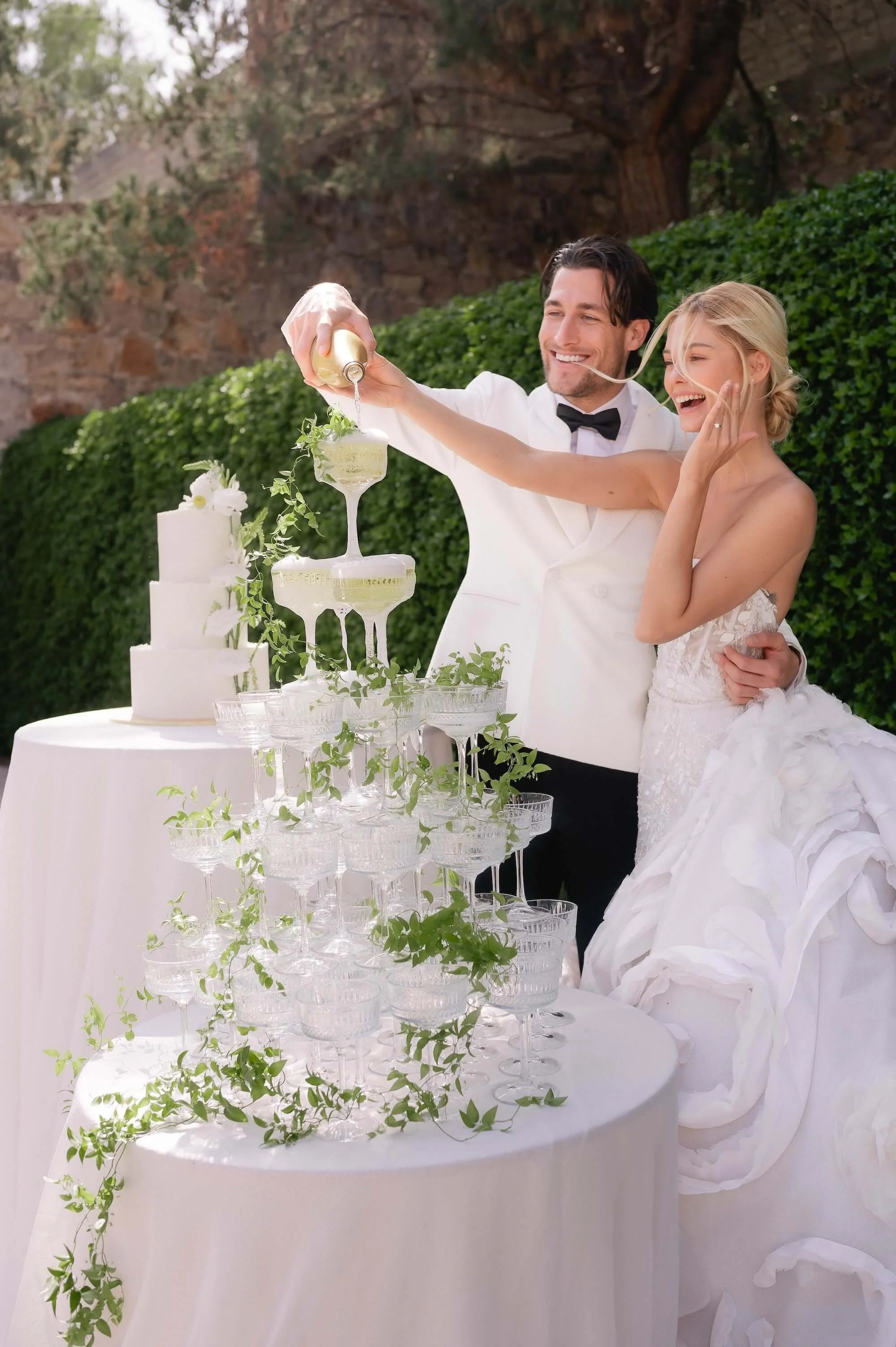 Fine art wedding portrait with white floral bouquet and couture gown in hacienda venue
