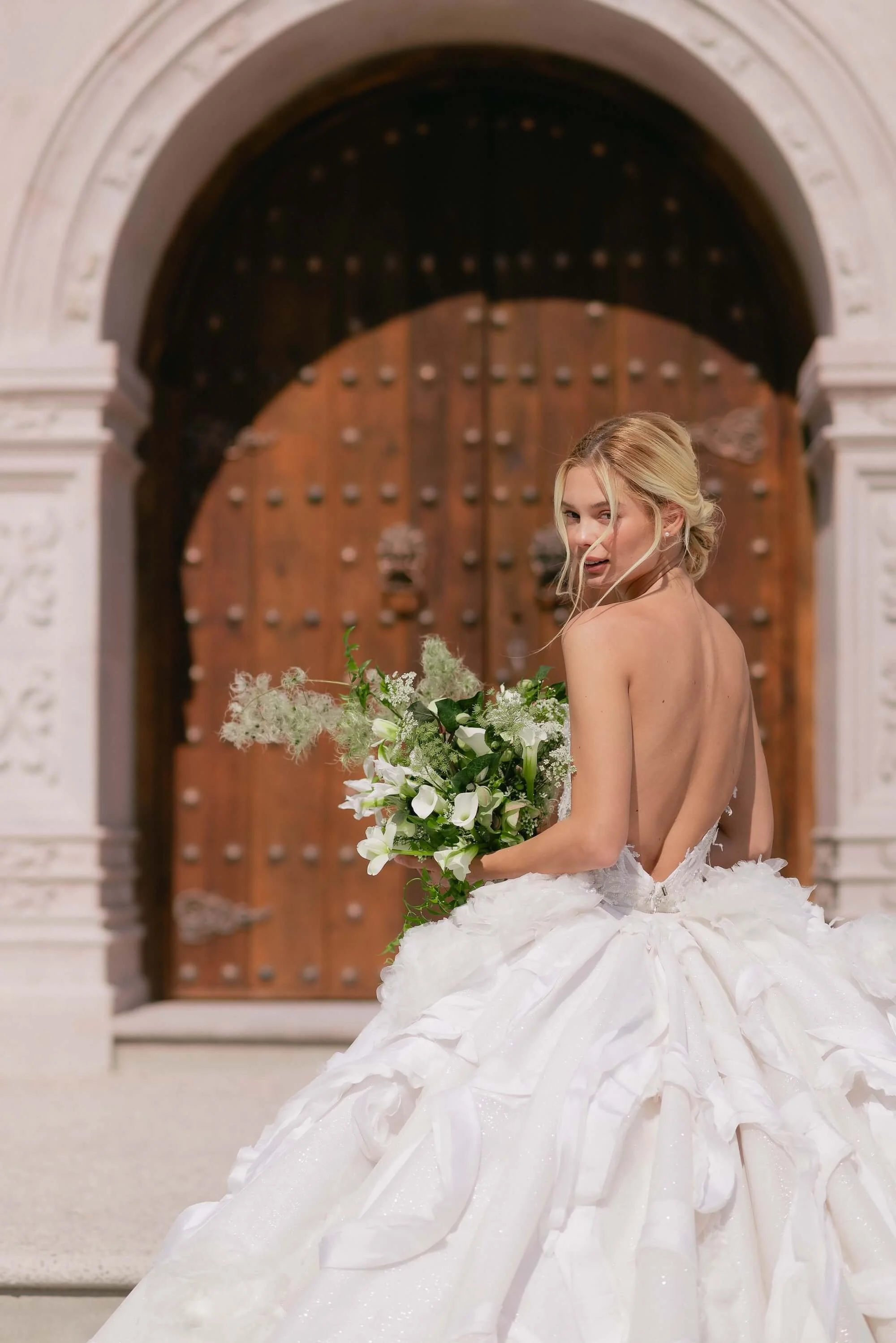 Elegant destination wedding floral design with natural white blooms and airy greenery in Mexico