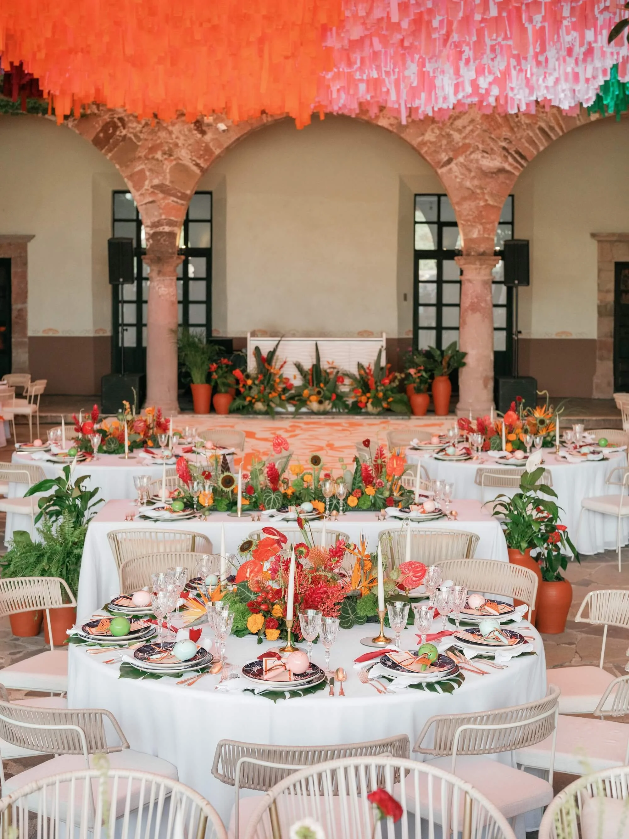 ceremony space framed by organic florals and natural textures