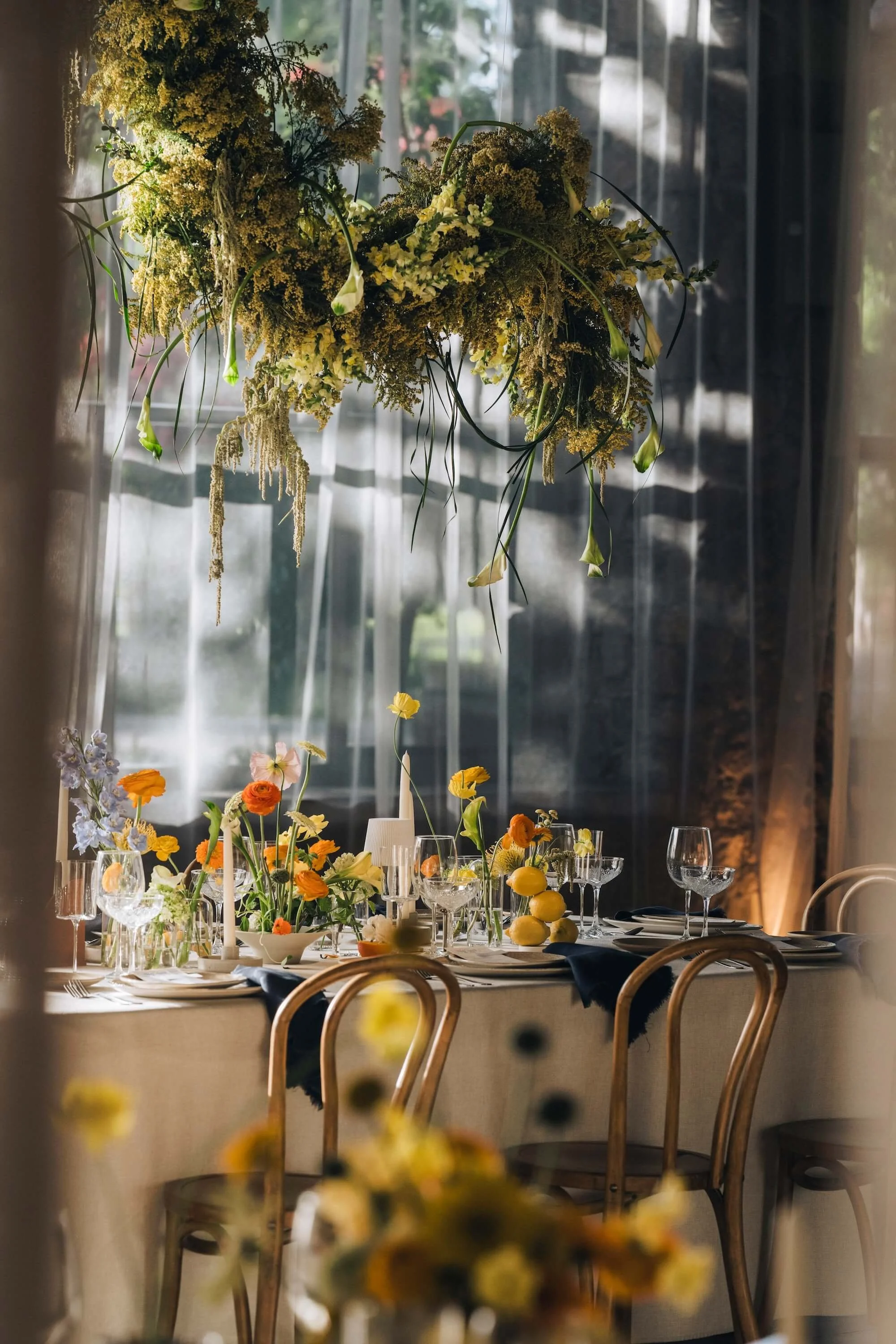 a ceremony framed by soft layers of floral composition
