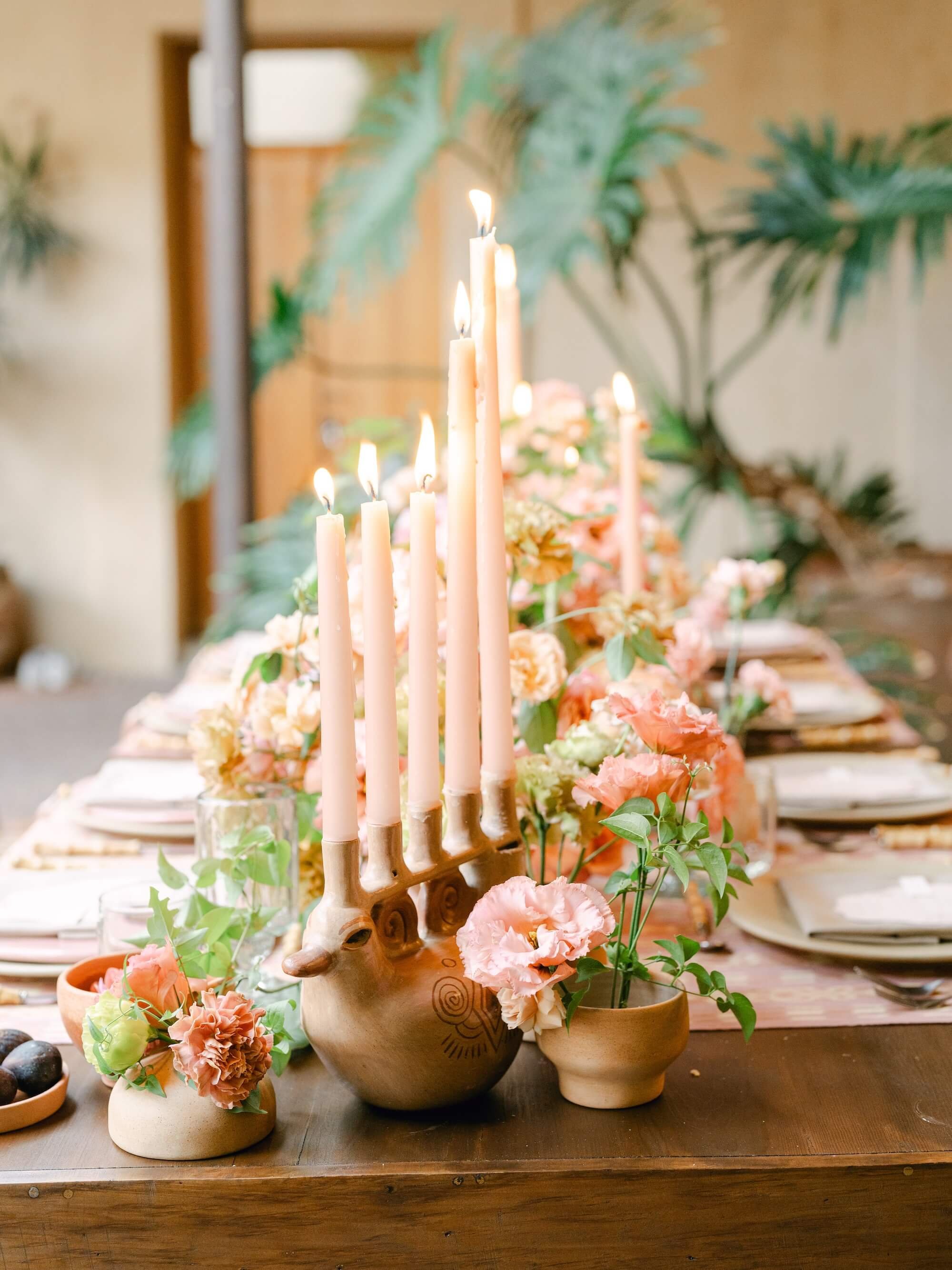 high-end floral design featuring organic foliage and nature-inspired tablescape